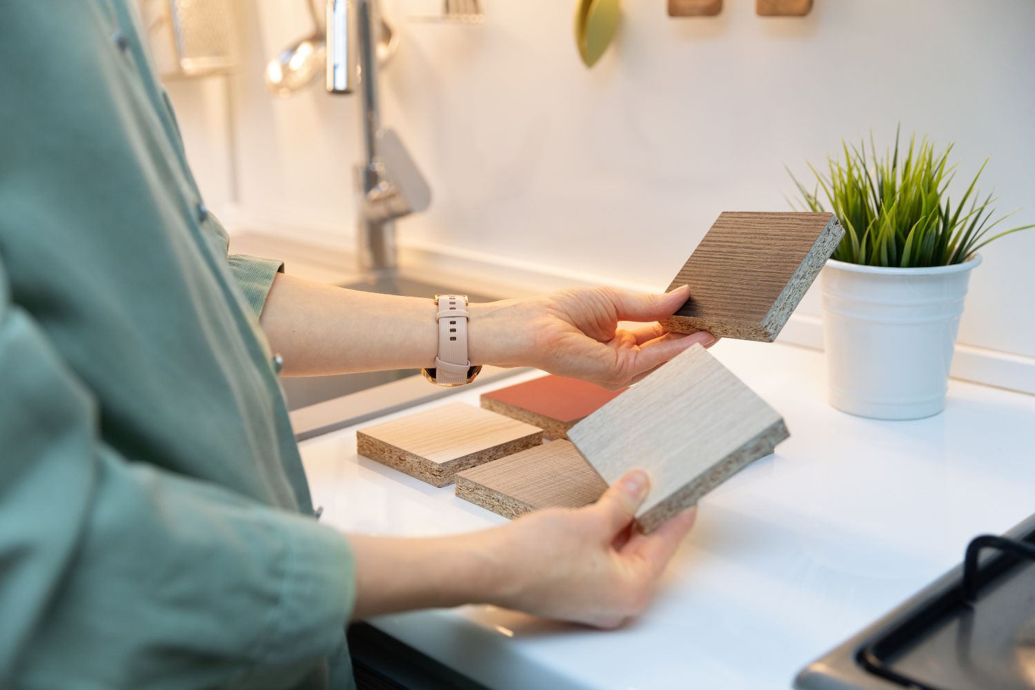 woman holding flooring samples in showroom want to build a custom home these are the roles you'll need.png