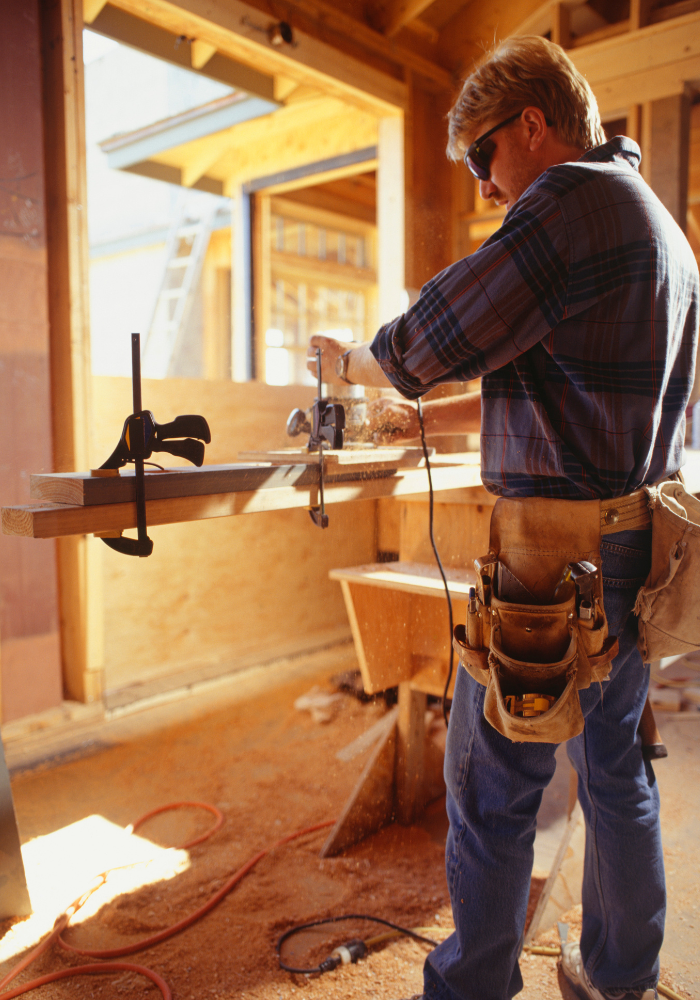 on-site builder in framed home with tools want to build a custom home these are the roles you'll need.png