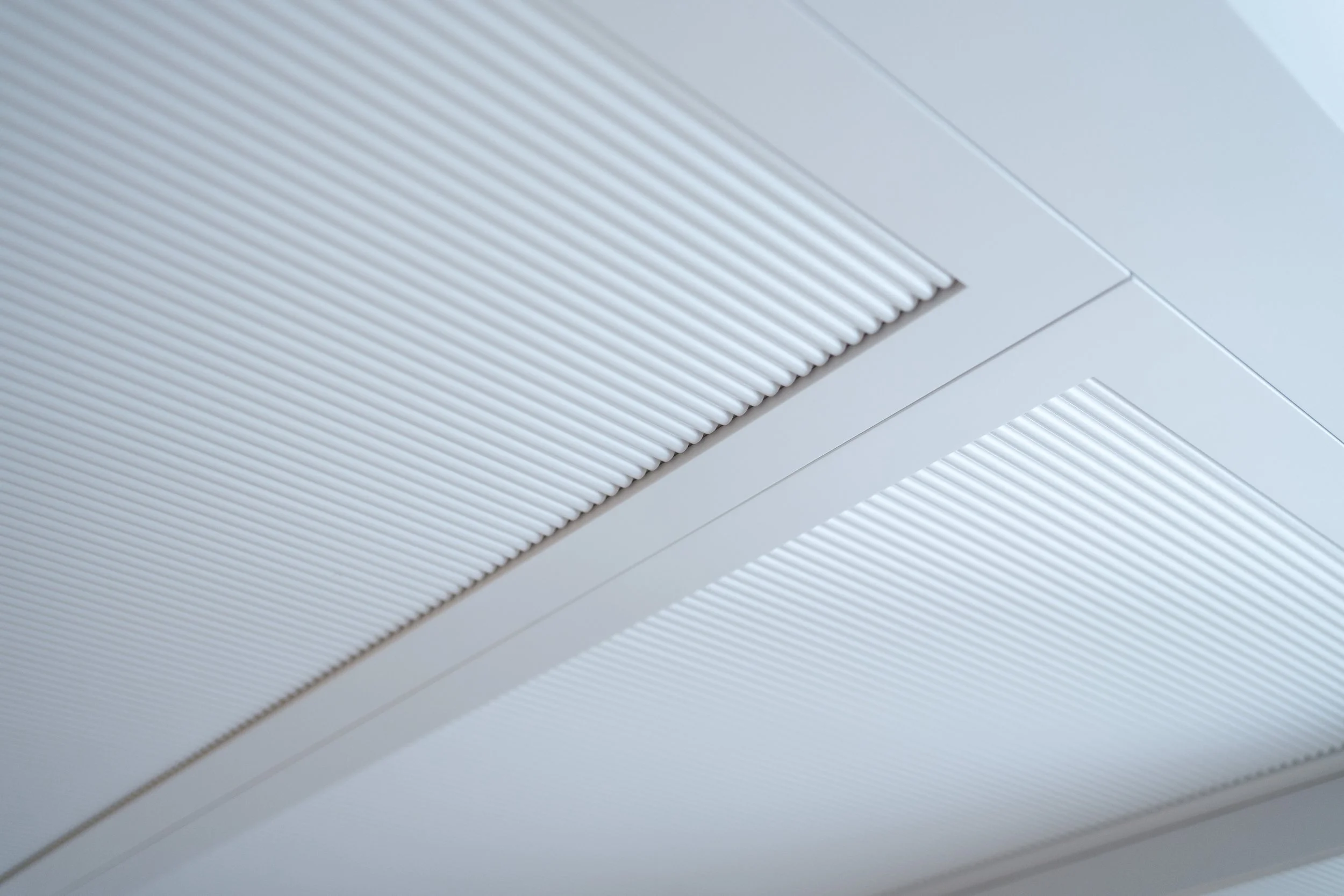 Built-in cabinetry with removable panels providing access to a concealed HVAC system