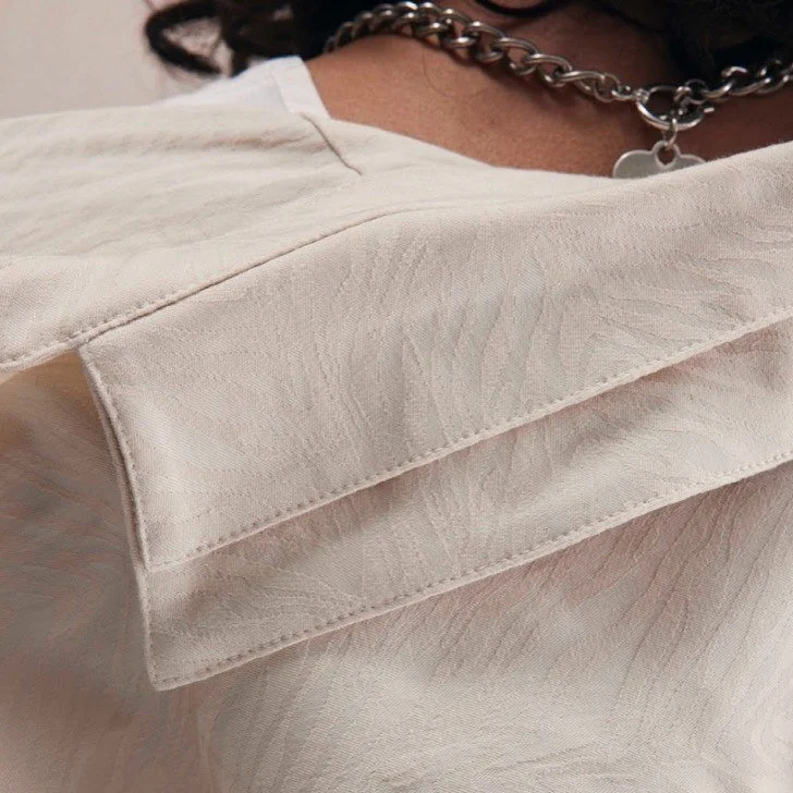Close up of our Oversized Light Ivory Button Up.