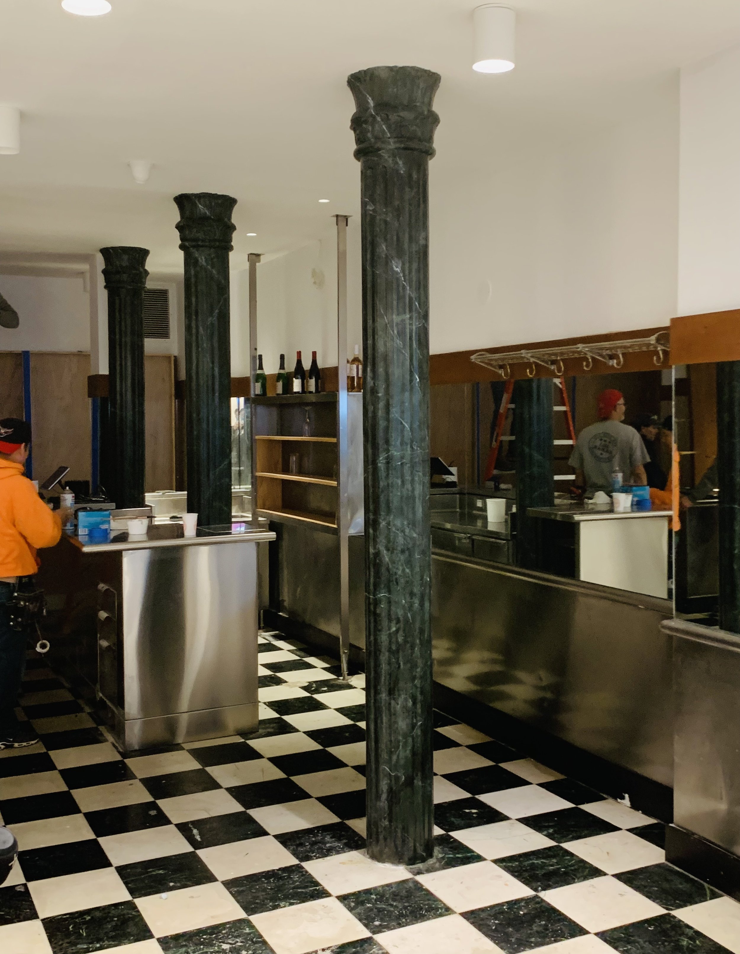 Rendered marble columns at EAT restaurant, 1064 Madison Ave, NYC, 2024