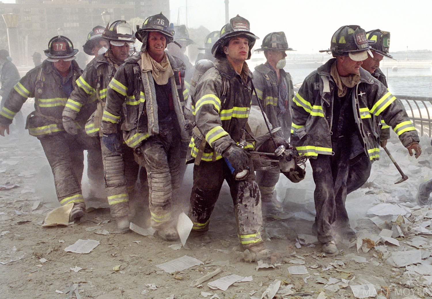  FDNY firefighters carry fellow firefighter, Al Fuentes, who was injured in the collapse of the World Trade Center on Sept. 11, 2001. 