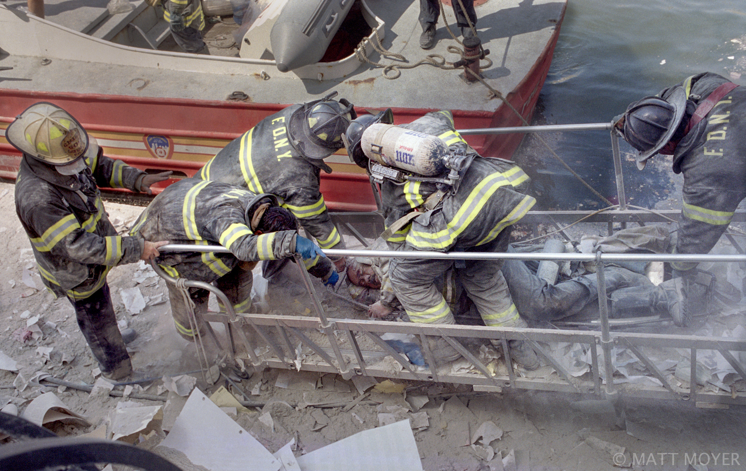  FDNY firefighter, Al Fuentes, is evacuated from a marina in lower Manhattan after he was injured in the collapse of the World Trade Center on Sept. 11, 2001. 