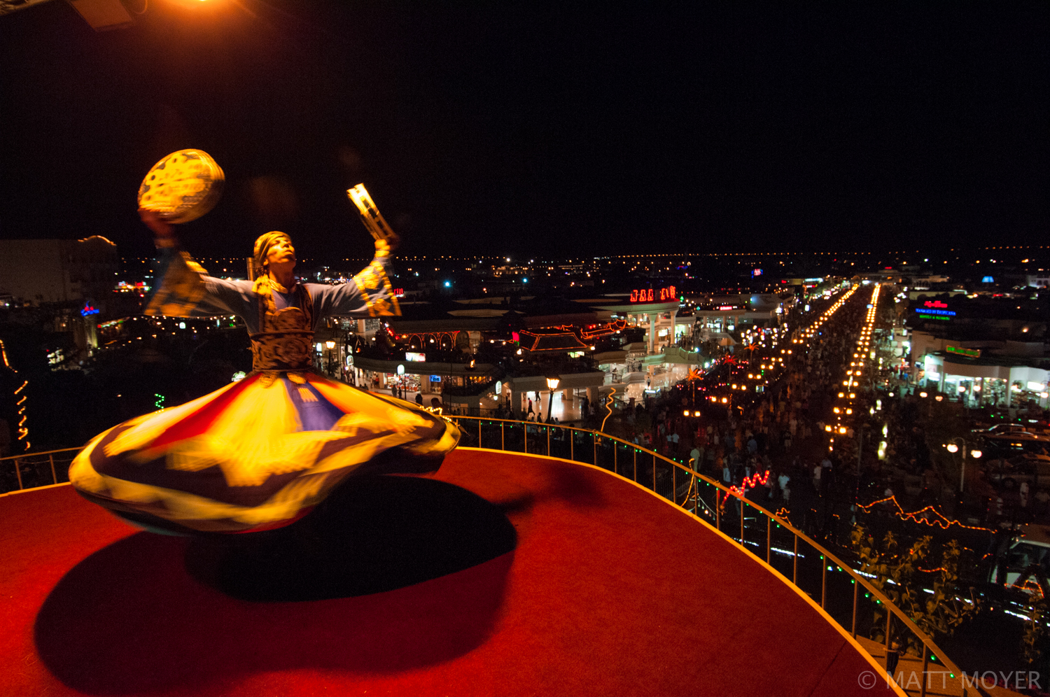  A sufi dancer performs above one of the main strips in Nama Bay, Egypt. 