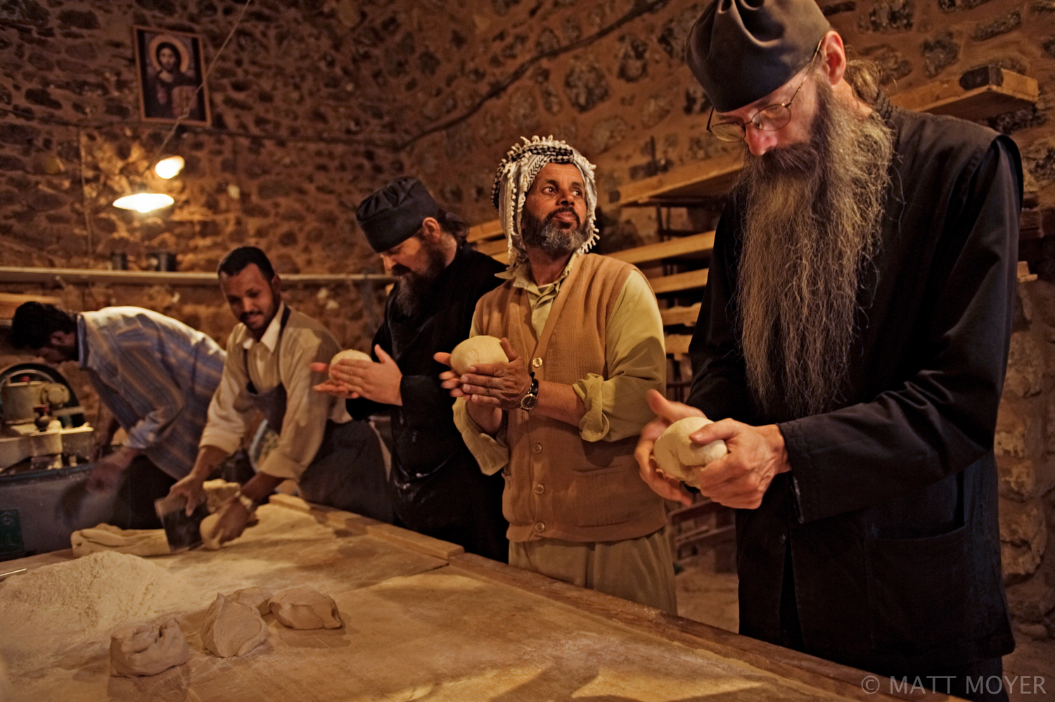  Christian monks shape bread dough into loaves with several Bedouins at the Monastery of St. Catherine in Egypt's Sinai peninsula. 