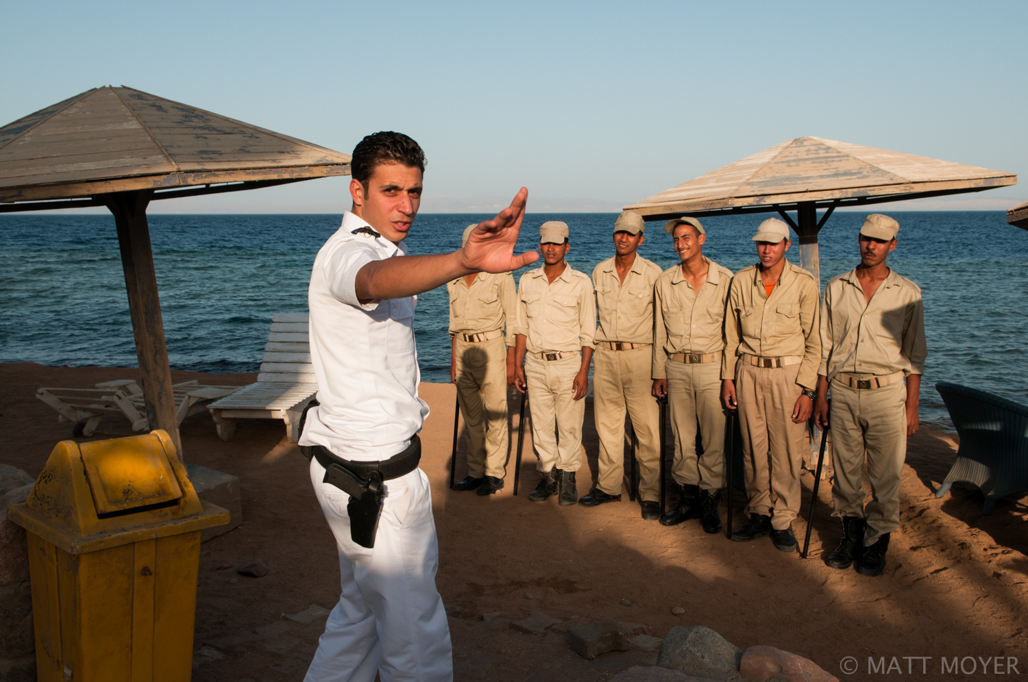  A Mubarak era police officer stops the photographer from taking a pictures in Dahab, Egypt. 