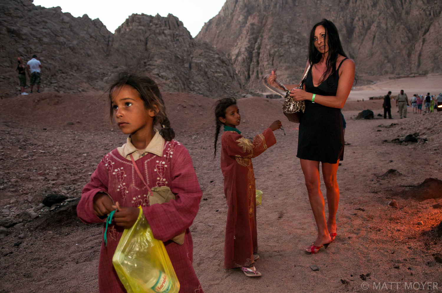  Bedouin children sell trinkets to wealthy tourists outside a "desert" party near Sharm El Sheikh. 