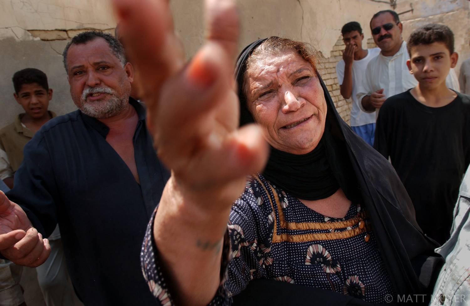  An Iraqi woman cries after having her home ransacked by a mob that attacked a group of brothels and beer sellers in her run down neighborhood in Basra, Iraq. The mob, made up of men and boys from the neighborhood and a few Islamists, threw stones at