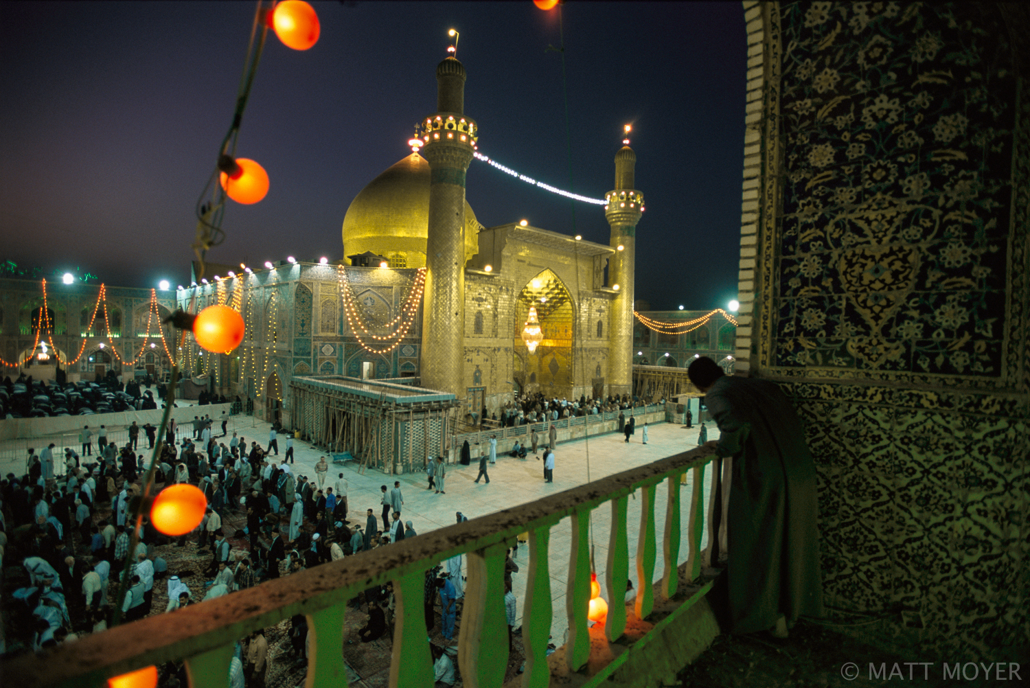  Shelled during the failed anti-Sadam uprising of 1991, and used as a base by insurgents fighting the US in August, the Imam Ali Shrine, one of the holiest Shiite Muslim sites, glows as crowds gather for evening prayer in Najaf, Iraq. 