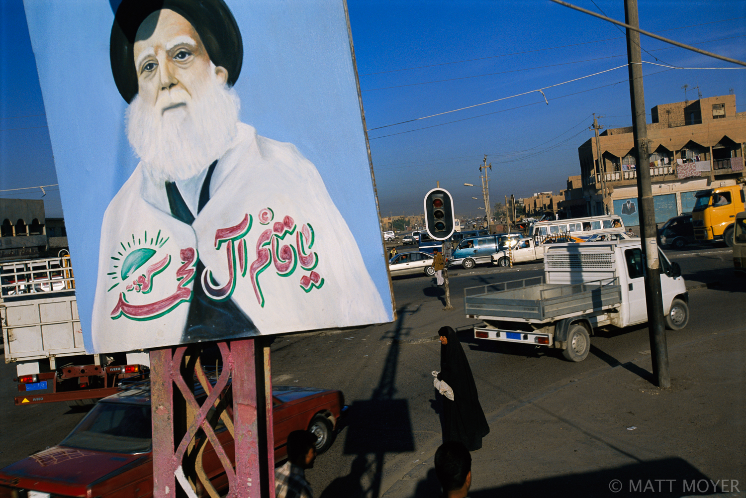  A painting of Mohammad Sadik el Sadr, the revered Shiite cleric, hangs over an intersection in Sadr City, Iraq. Sadr City, named after the cleric who was killed by Saddam in the late 1990s, used to be called Saddam City. With the fall of Saddam Huss