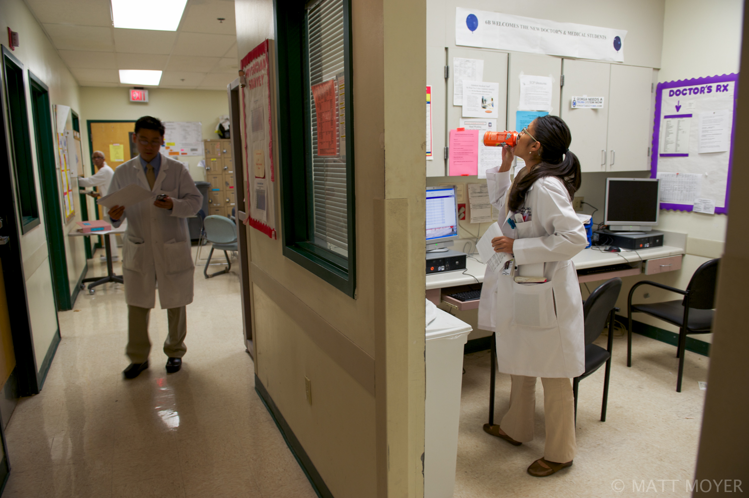  Twenty five-year-old surgical resident, Dr. Carla Haack, prepares for her morning rounds by taking a slug of Full Throttle Fury, a highly caffeinated drink, at Grady Memorial Hospital. Haack works very long hours but loves her job. 