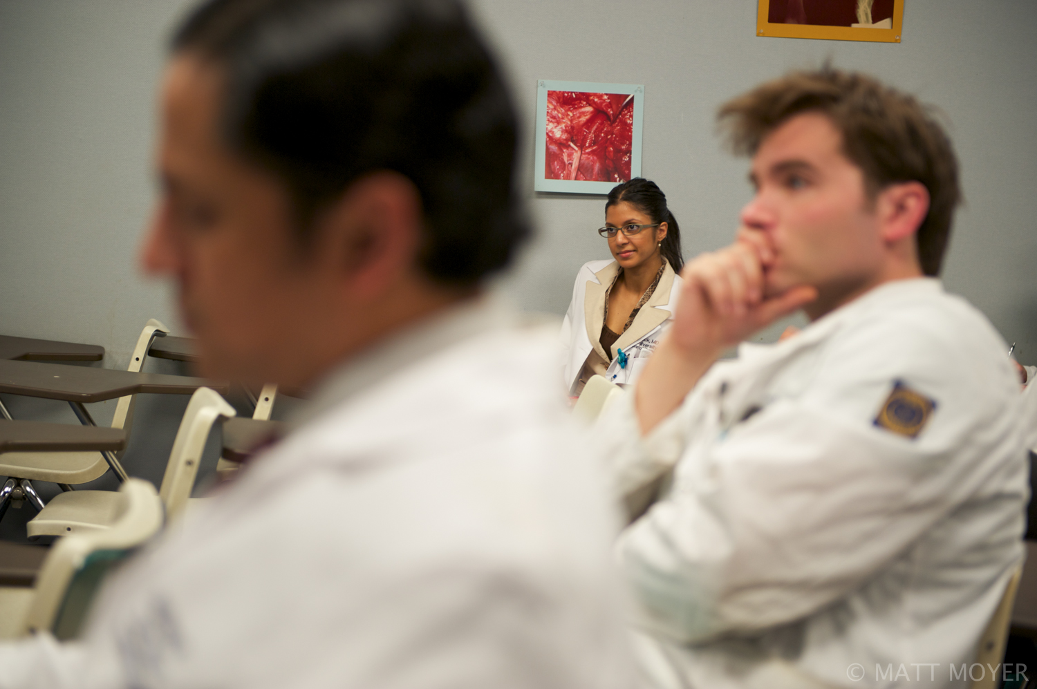  Dr. Carla Haack, center, a twenty five-year-old surgical resident, sits in on a medical briefing at Grady Memorial Hospital. 