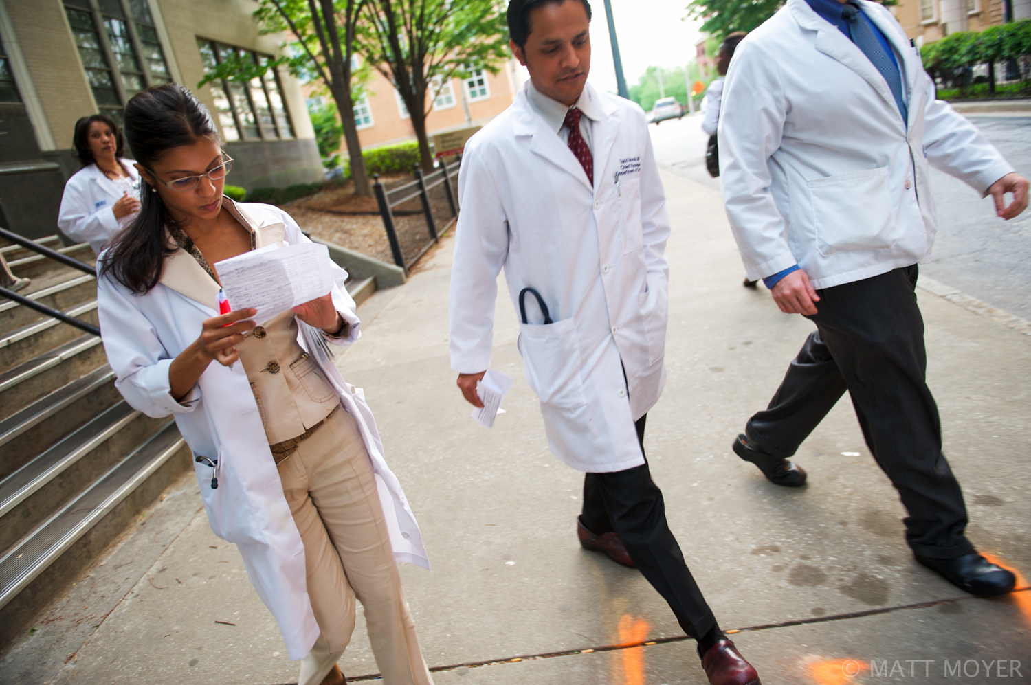  Dr. Carla Haack, left, a twenty five-year-old surgical resident, walks with colleagues outside Grady Memorial Hospital. 