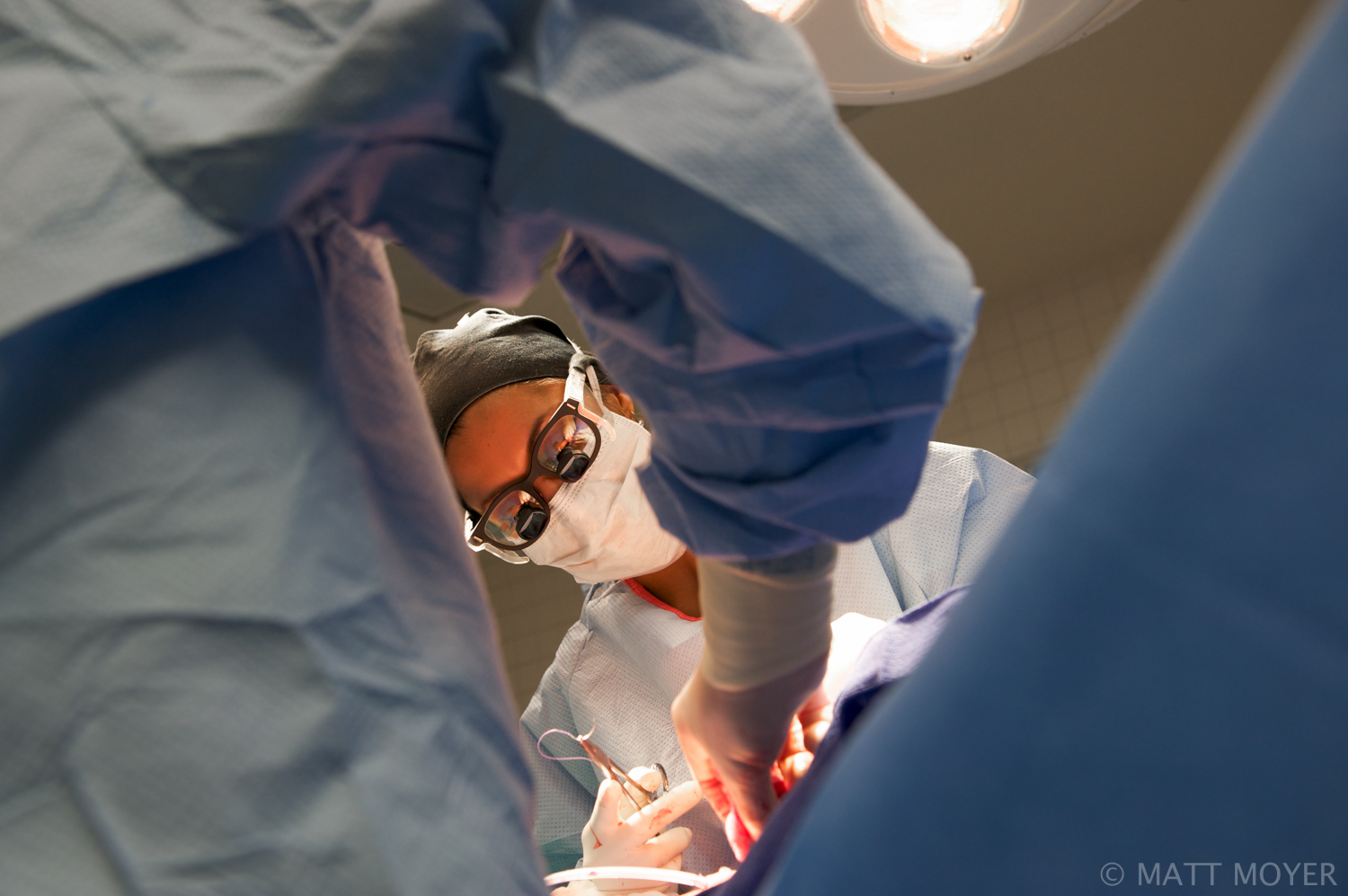  Dr. Carla Haack, left, a twenty five-year-old surgical resident, performs a surgery at Grady Memorial Hospital. 