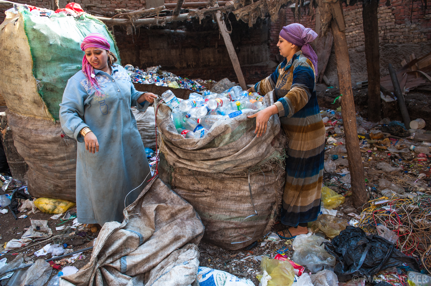  Egyptians work sorting trash in a Coptic Christian neighborhood in Cairo. Most of the people who work collecting garbage in Cairo are Coptic Christians. 