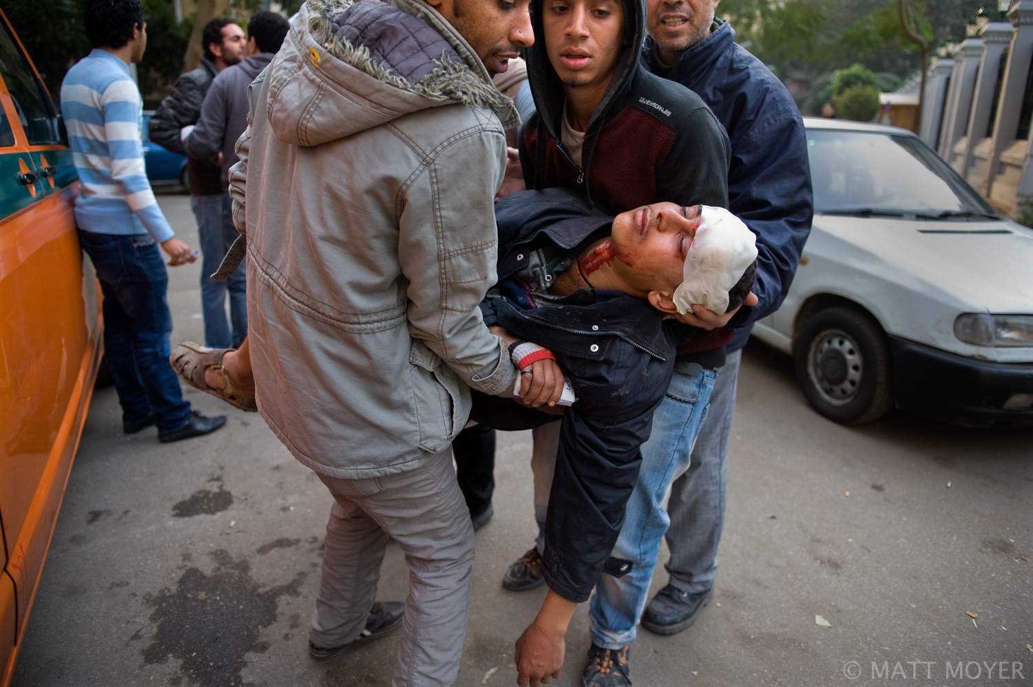  An Egyptian protester is rushed to an ambulance after being injured in clashes with government forces in Cairo, Egypt. 