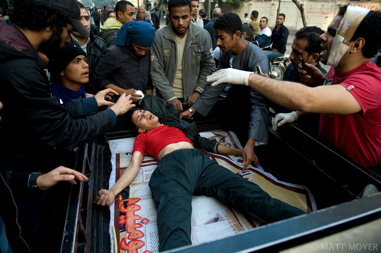  An Egyptian protester is rushed to the hospital after being injured in clashes with government forces in Cairo, Egypt. 