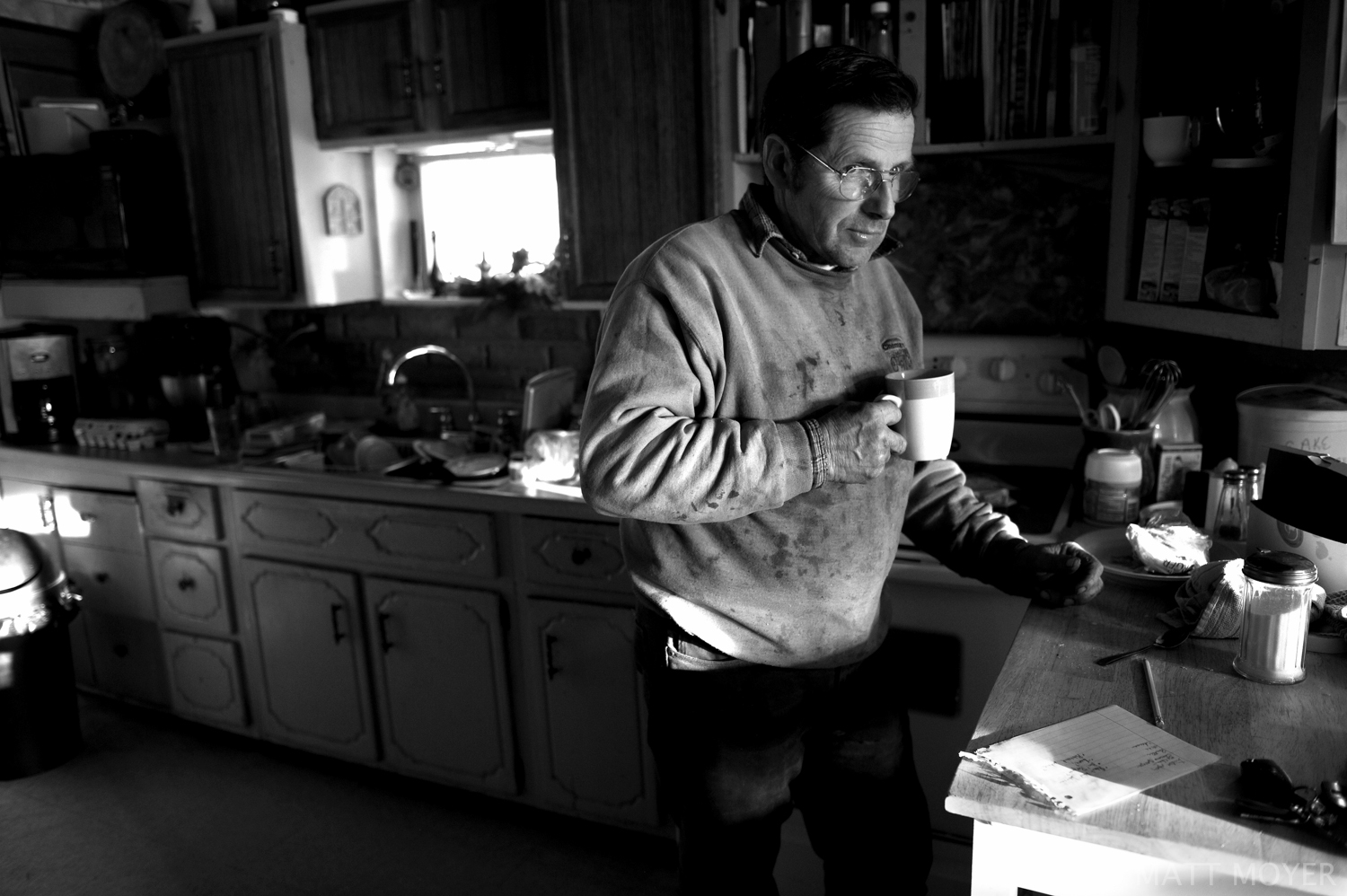  Joe Tidd drinks a cup of coffee in the kitchen of his farm house in Auburn, NY. Joe runs a small dairy farm in upstate New York. They have been hit hard by the recent drop in milk prices. They recently had to get rid of their health insurance becaus