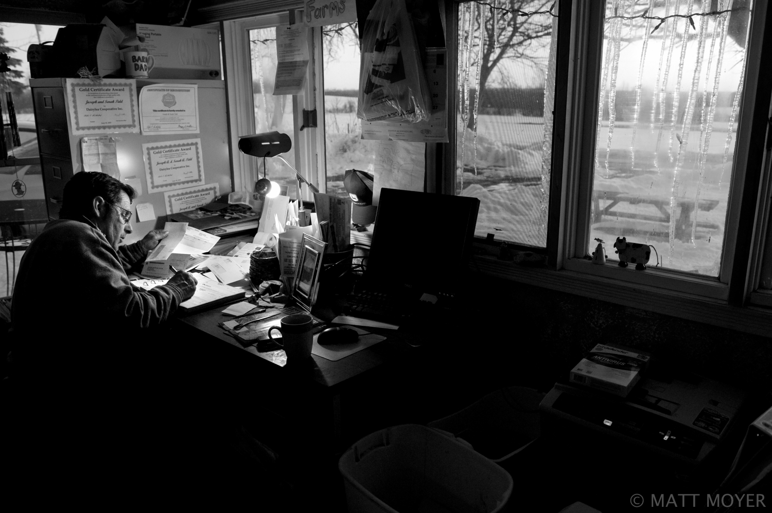  Joe Tidd looks over bills at his farm house in Auburn, NY. 