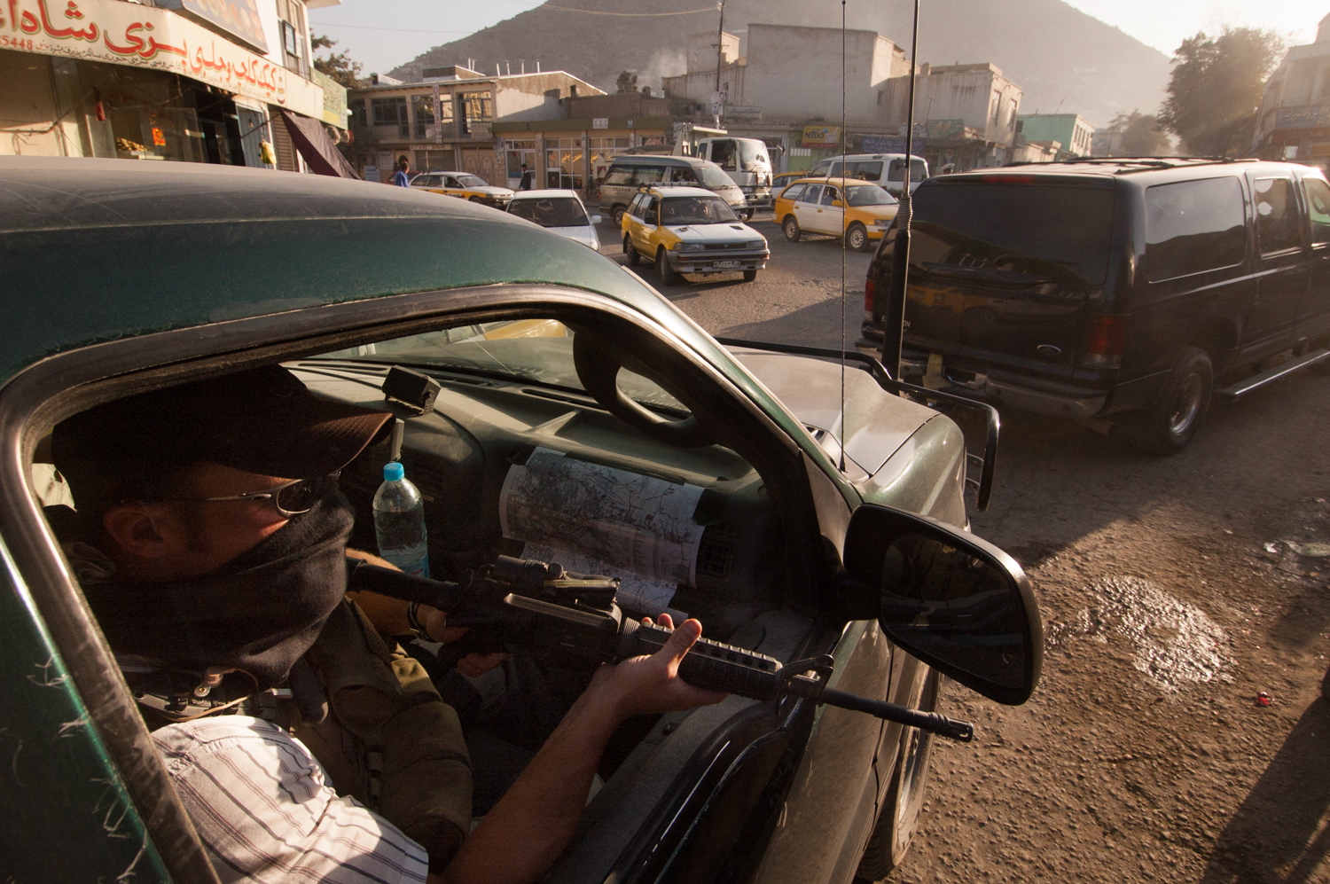  Private security contractor, Neil Gary, a former US Marine, rides in an SUV while providing security for a convoy in Kabul, Afghanistan. 