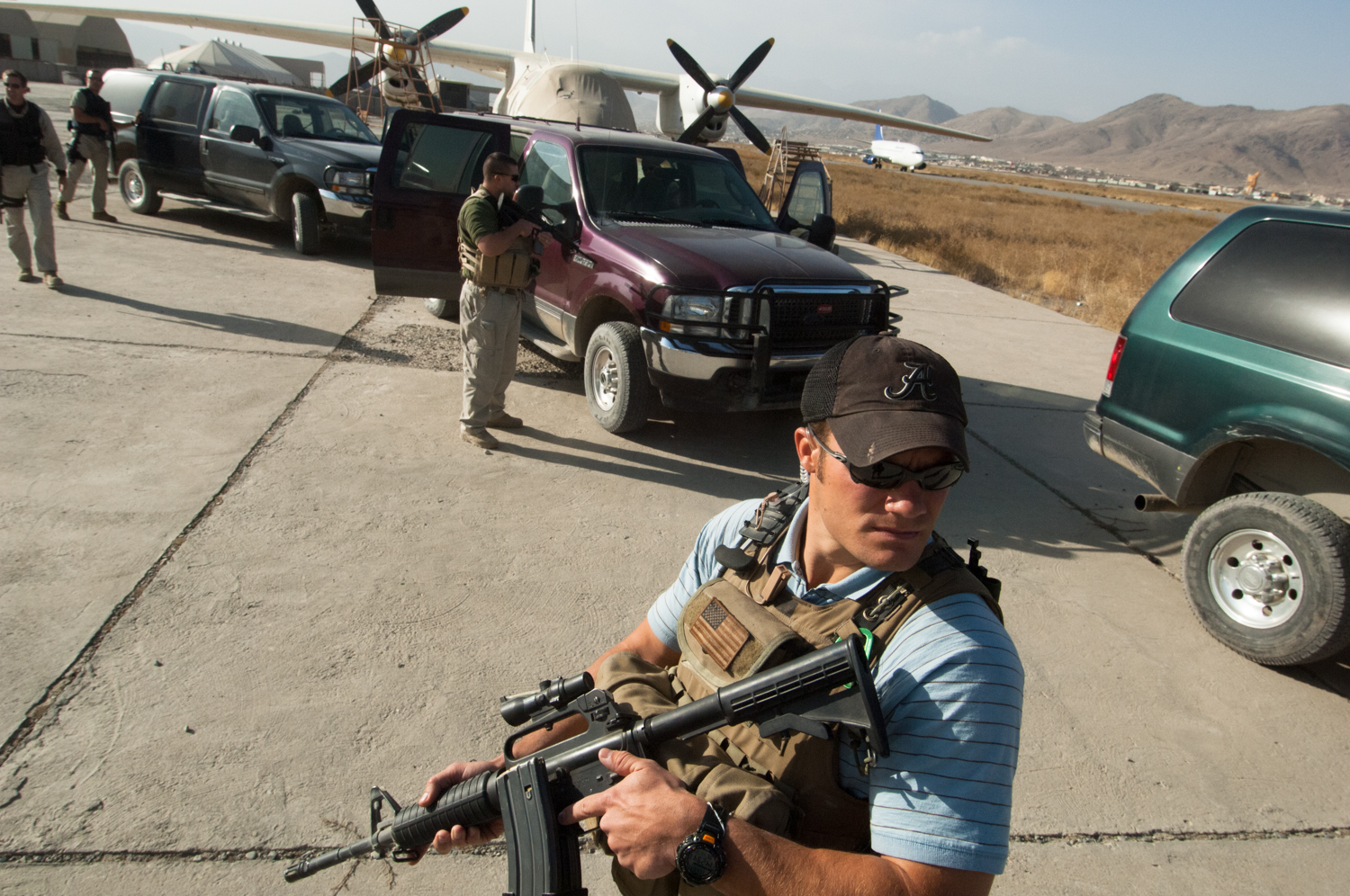  Private security contractor, Neil Gary, keeps a sharp eye open for potential threats while providing security at Kabul's airport in Kabul, Afghanistan. 