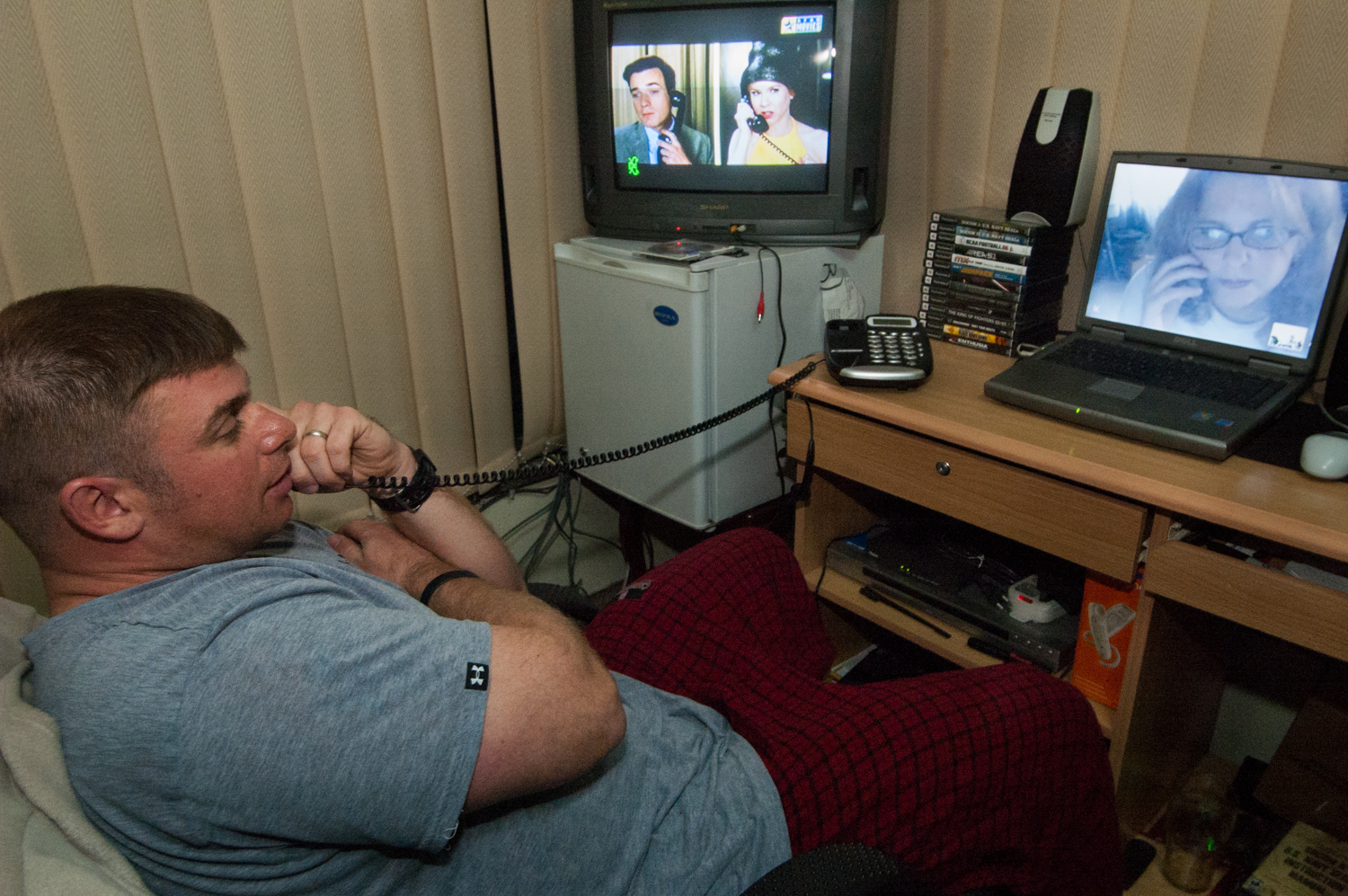  Private security contractor, Mike Stocksett, talks to his wife via internet video connection in his room at a company compound in Kabul, Afghanistan. Stocksett, who has been deployed to both Afghanistan and Iraq, says he has watched his young son gr
