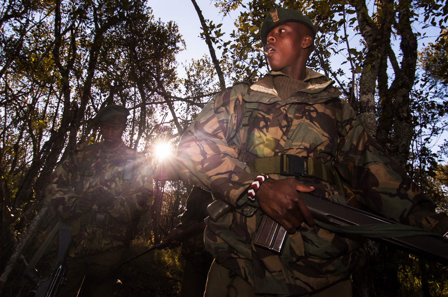  Members of an anti-poaching unit patrol a neighboring sanctuary wildlife park in Lewa Downs, Kenya. 