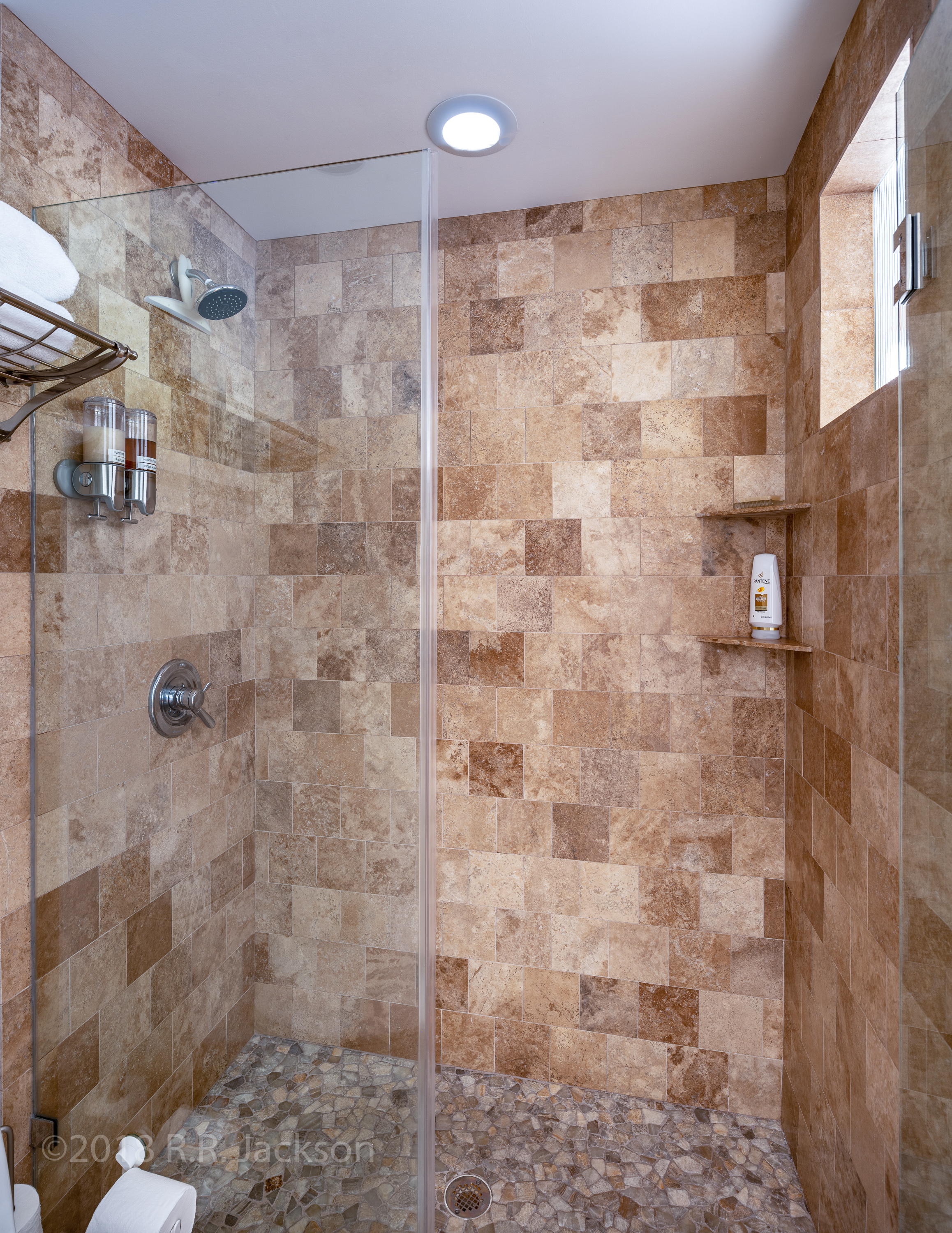 Walk-in shower with all that you need.