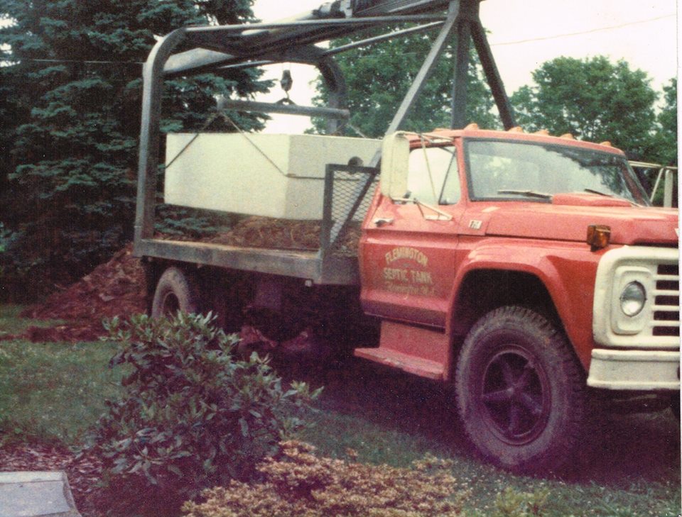 Previous owner George W. Hoffman delivering a septic tank, circa 1980's.