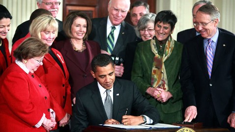 President Obama signing the Lily Leddbetter Fair Pay Act in 2012. 