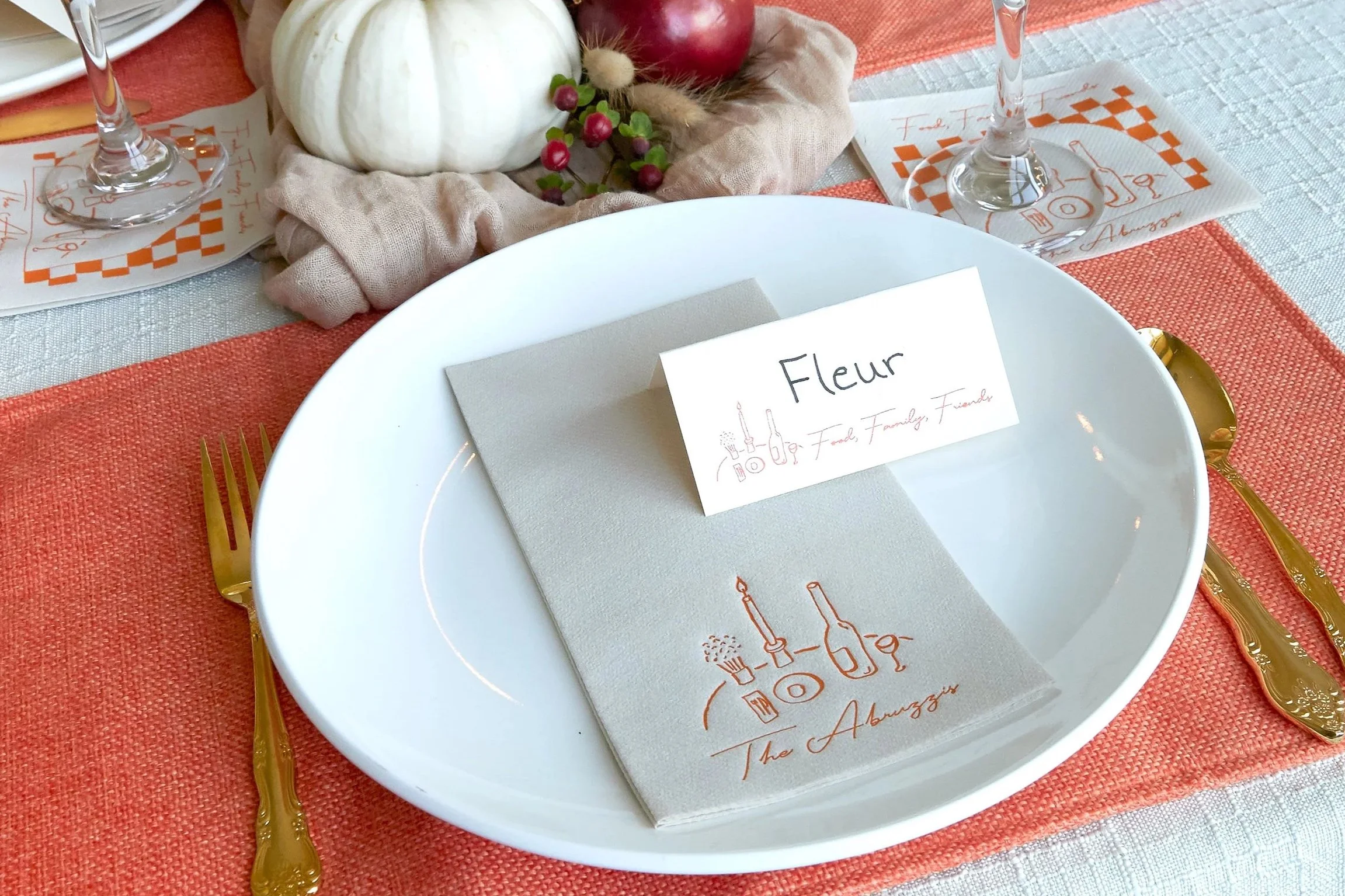 Wine bottle printed dinner napkin on a plate