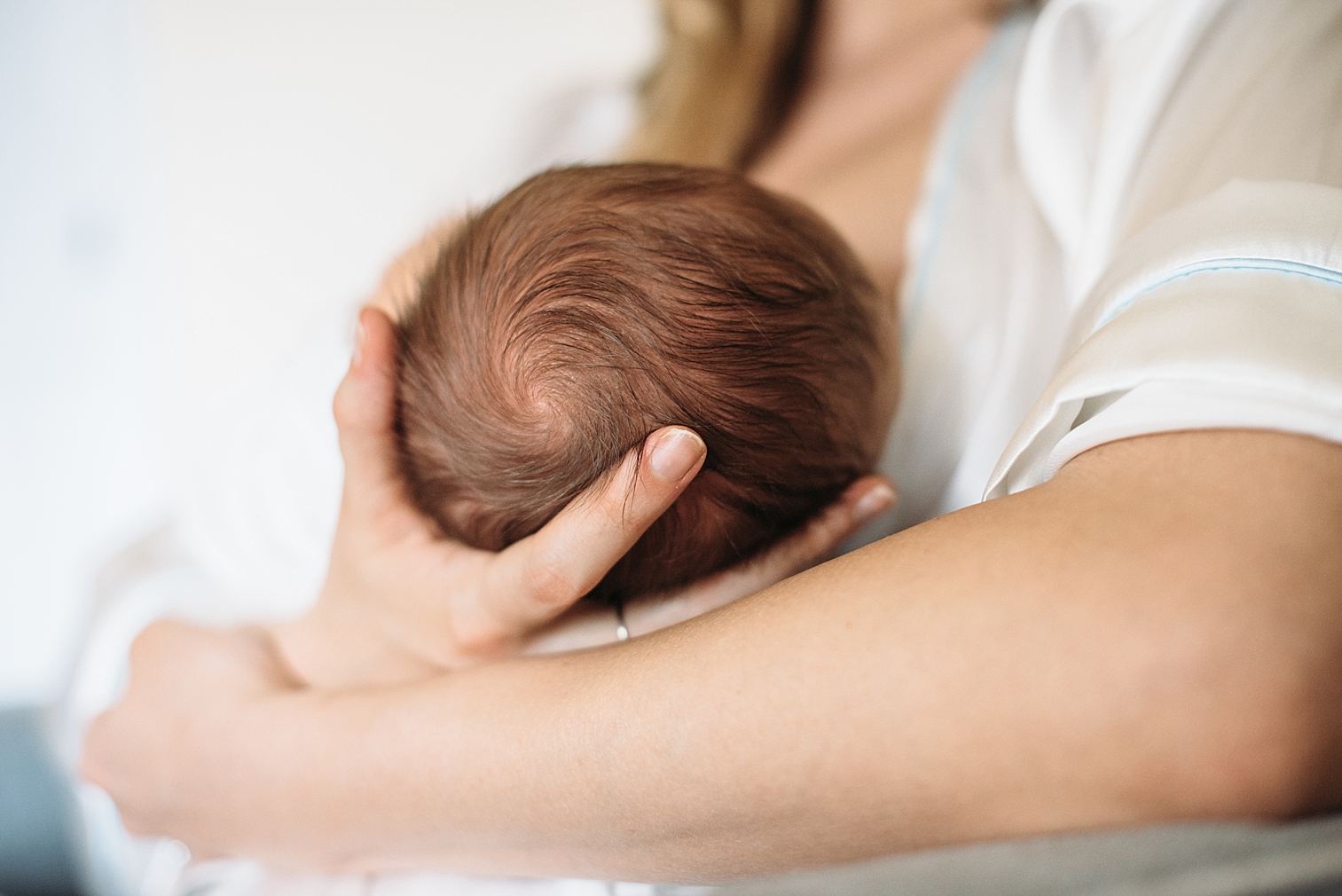  mom breastfeeds her newborn baby boy 