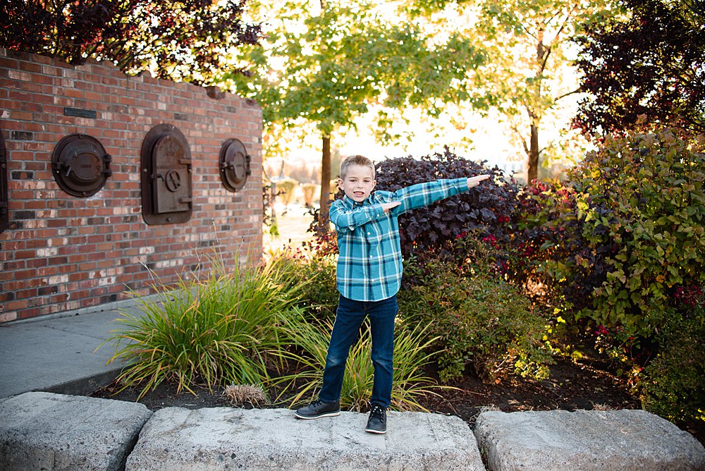  A young boy does the "dab" in the Old Mill District in Bend, Oregon 