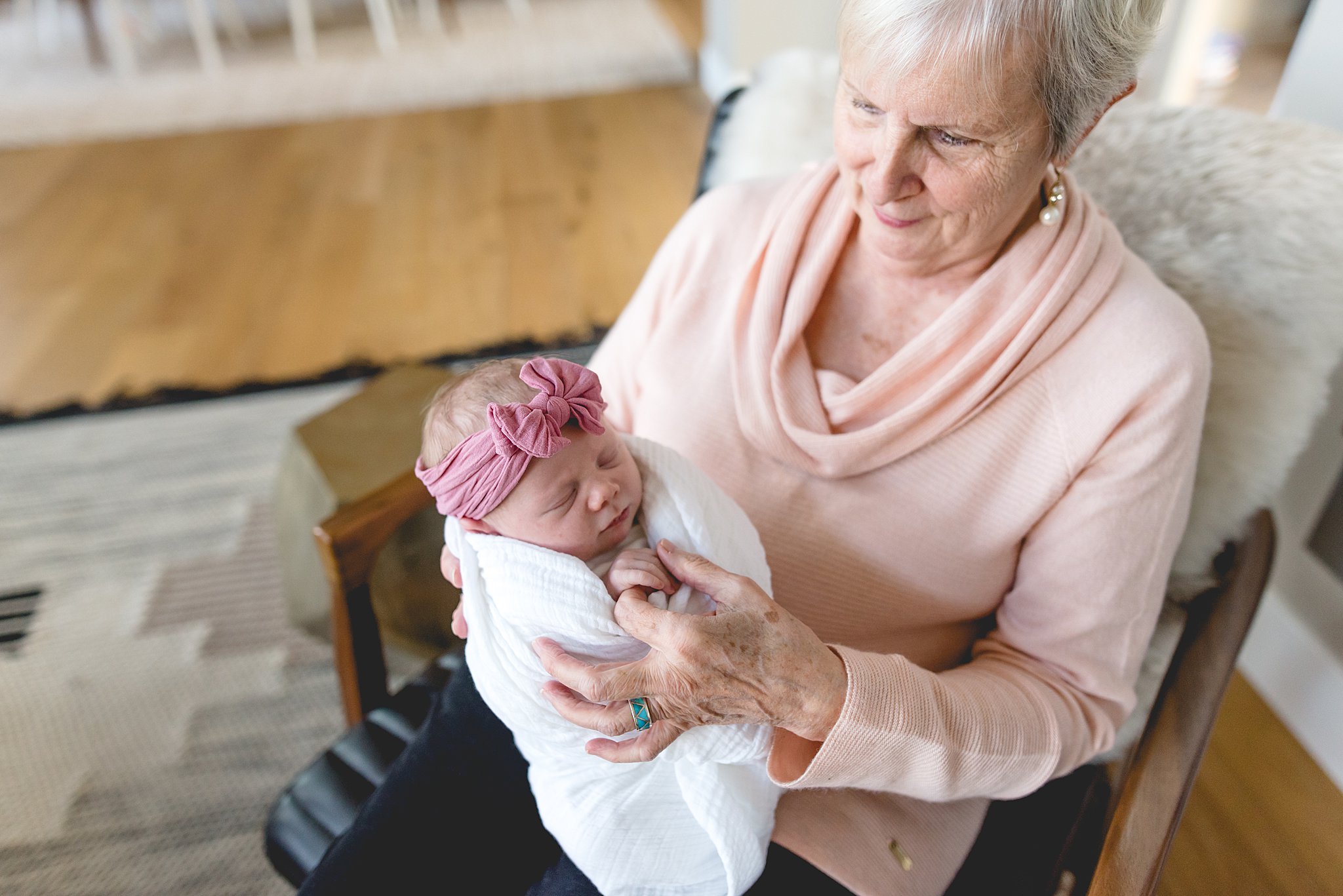  grandma holds her new granddaughter 