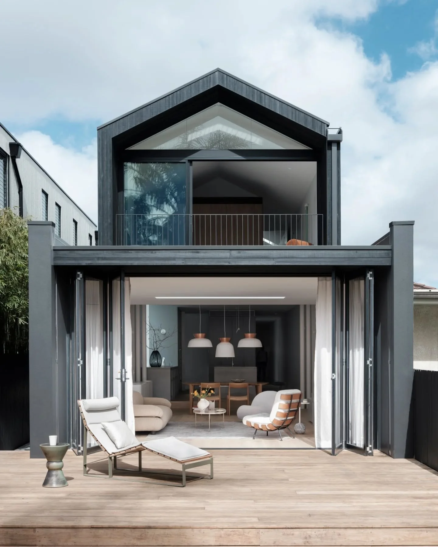 North Bondi SemiBold &bull; A striking dark exterior and an interior showcasing calm, light-filled living areas which flow effortlessly to the outdoors, balancing practicality and warmth to create a home designed for both everyday living and quiet re