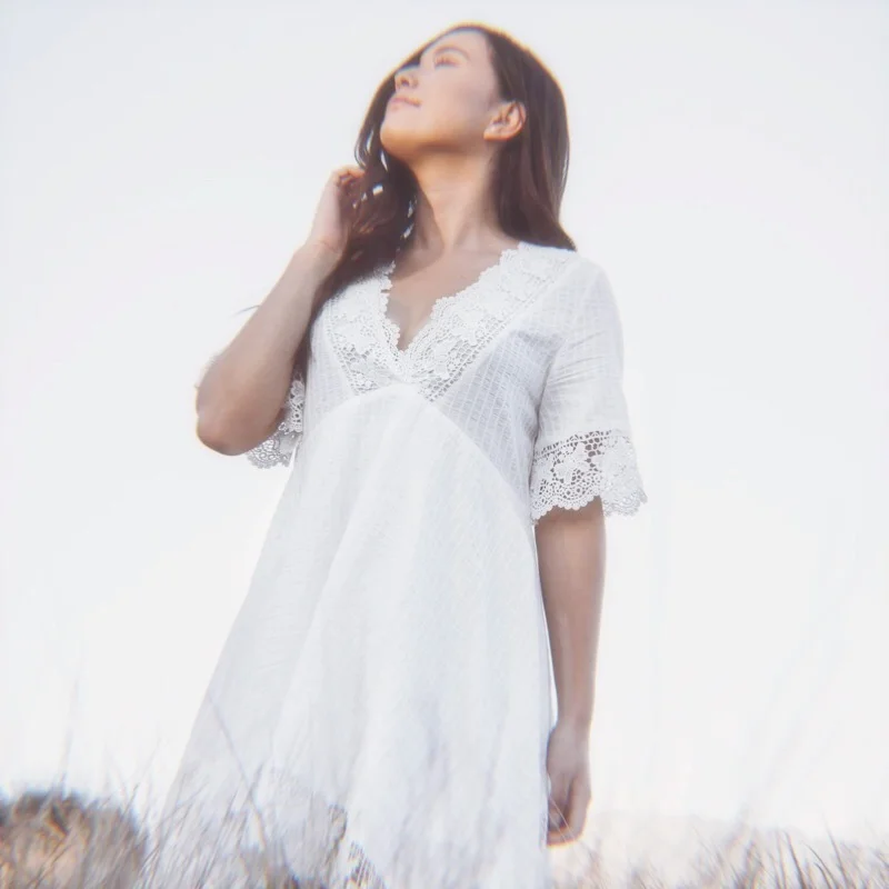 Woman Looking Up White Dress Field.jpg