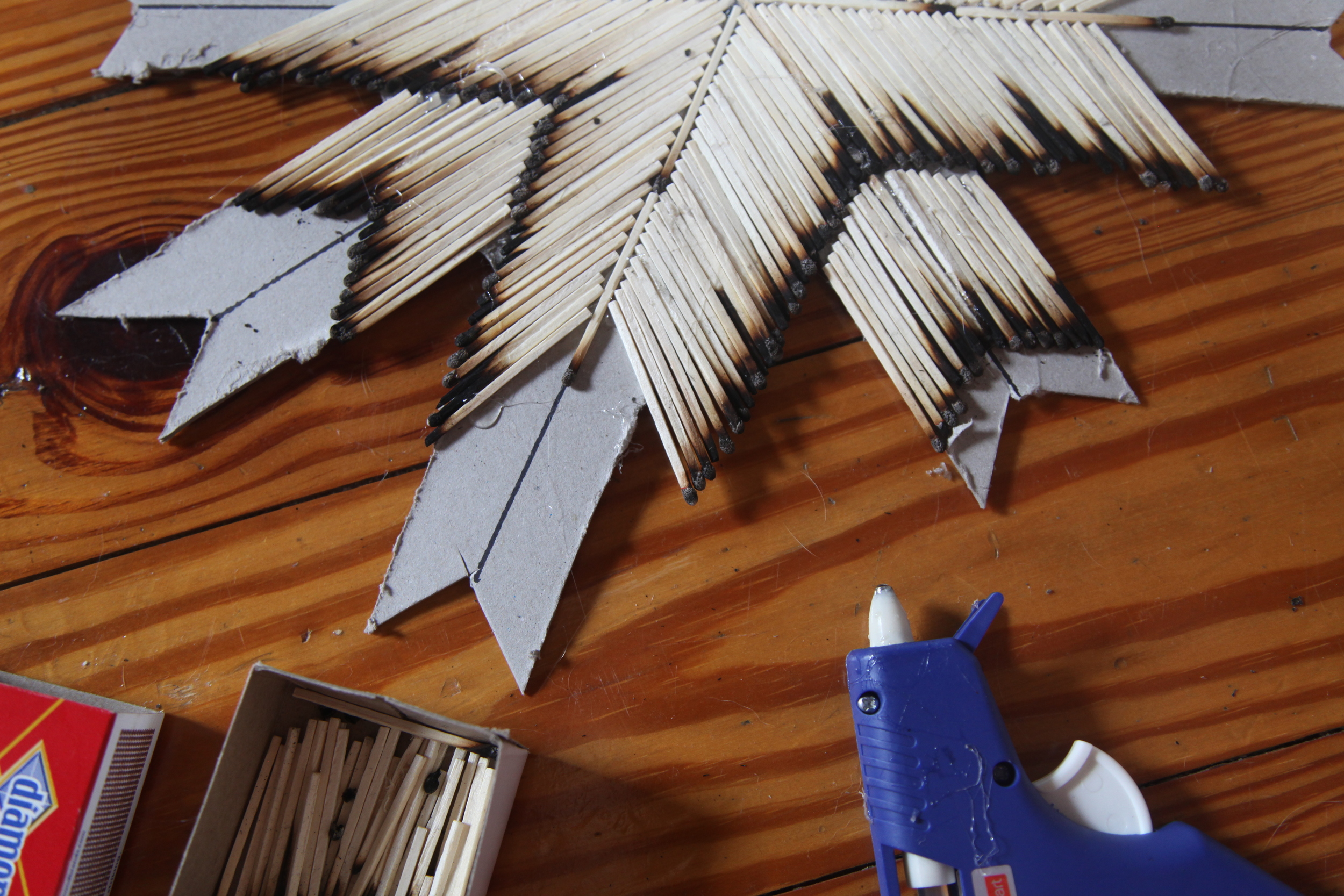 The second tier is just simply a mini version of the first. Repeat previous steps creating a mini arrow with burnt edges facing out. This will finish off every arrow except East & West.