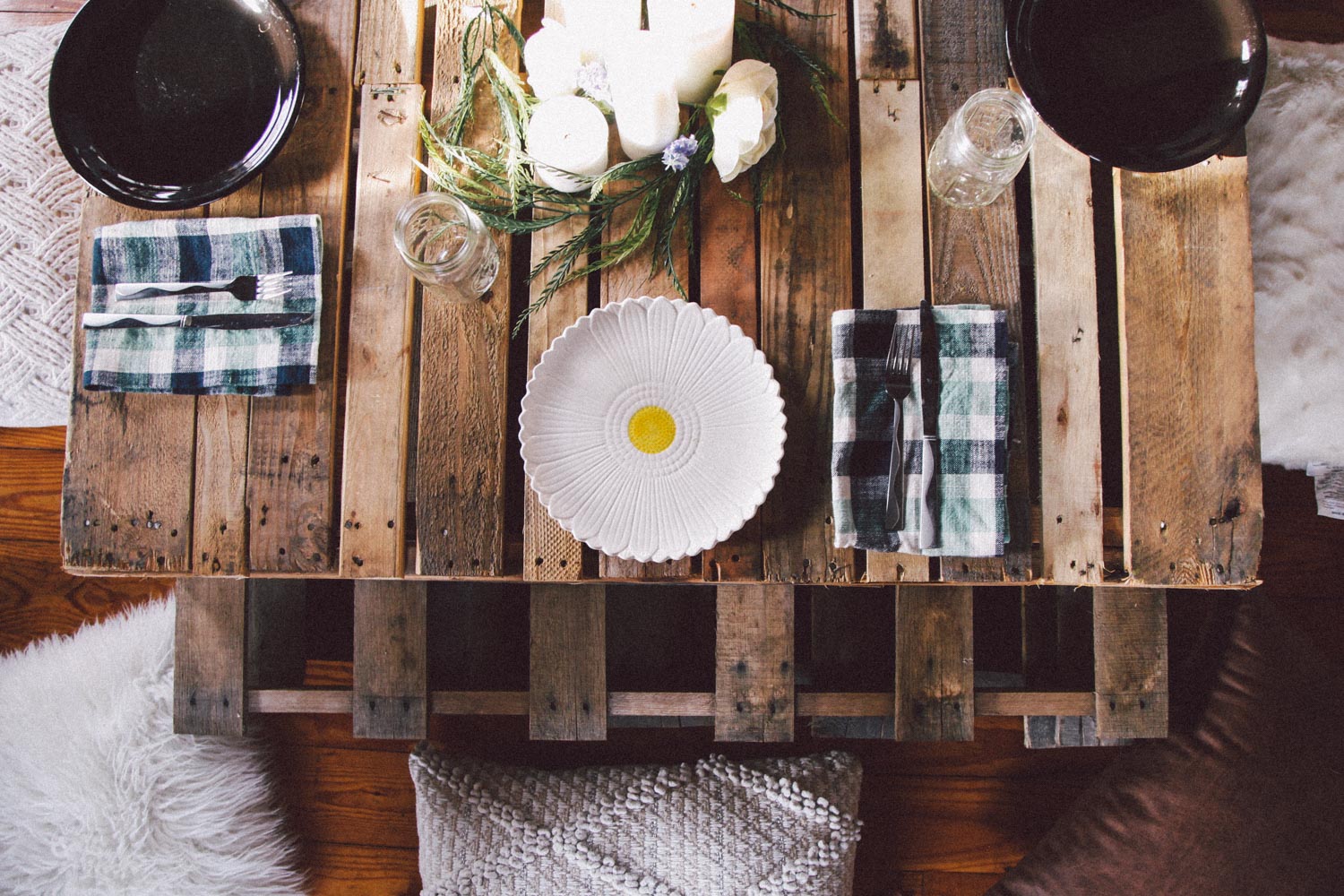 Don't be afraid to mix & match your table settings. Borrow some items from friends or family. I love the almost imperfect feel it brings. I bought mason jars to use as our drinking glasses to add to the rustic, homey feel. They are also inexpensive! I got enough for my whole party (with a few extras) for only $10! Just add candles and a few simple flowers, leaves, or succulents for easy decoration. My centerpiece was made mostly from the garden downstairs!