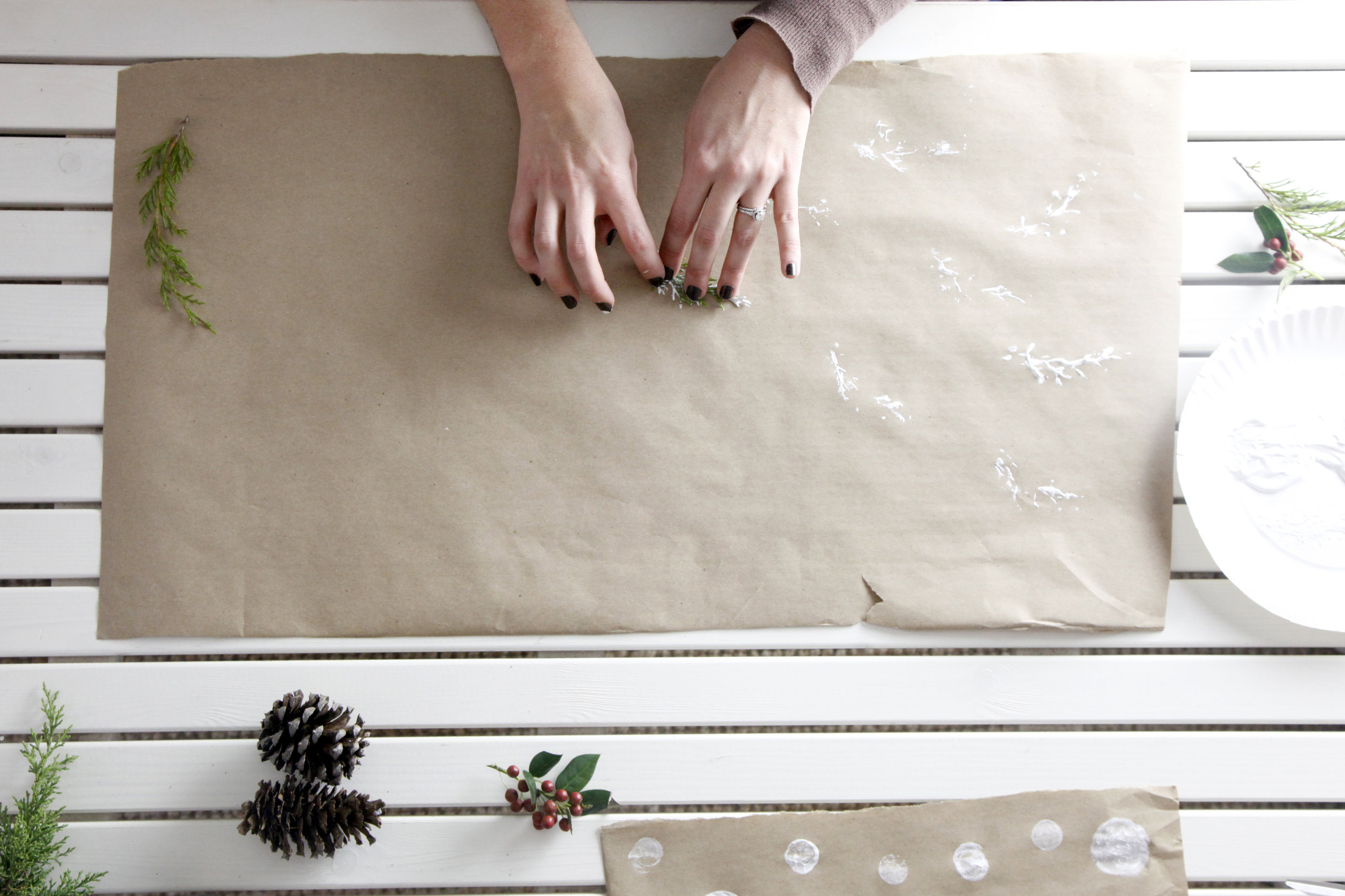 Then I took to - standard white acrylic paint and I started stamping! Test your make-shift stamps on a scrap piece of paper & once you get your desired stamp look, have a blast creating your customized wrapping paper in any fun pattern you choose! 