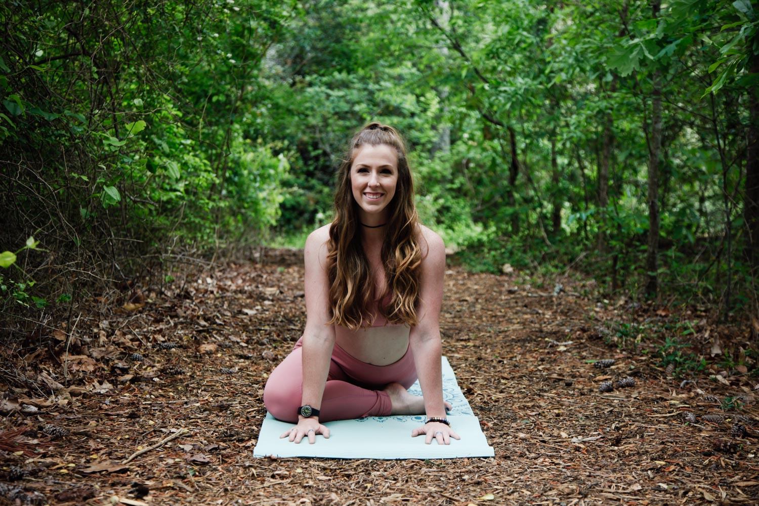 Pigeon Pose — From downward facing dog, inhale and reach your right leg up, flexing your right foot and pointing your toes toward the mat. As you exhale, bring your right knee in towards your nose and over towards your right wrist while your ankle moves toward the left. Keep your back leg straight behind you. Inhale reach your heart up, exhale walk your hands out to a comfortable position. Repeat on your left leg.