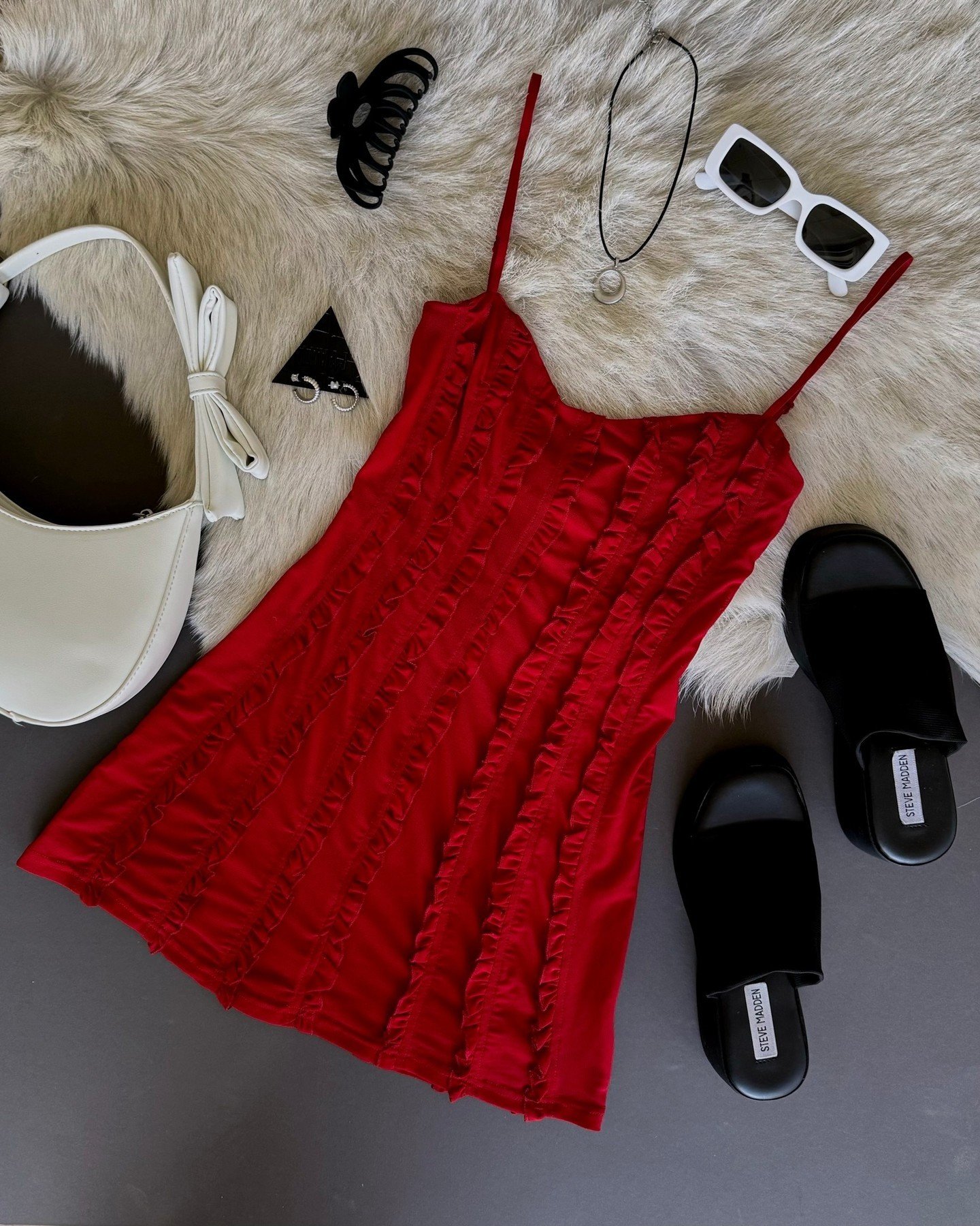 High heels... red dress 🎶❤️ Can't get enough of the Venetia dress, the perfect red mini for your Summer occasions ☀️⁠
⁠
This sexy dress features an A-line silhouette, soft sweetheart neckline, adjustable spaghetti straps, and vertical ruffle trimmed