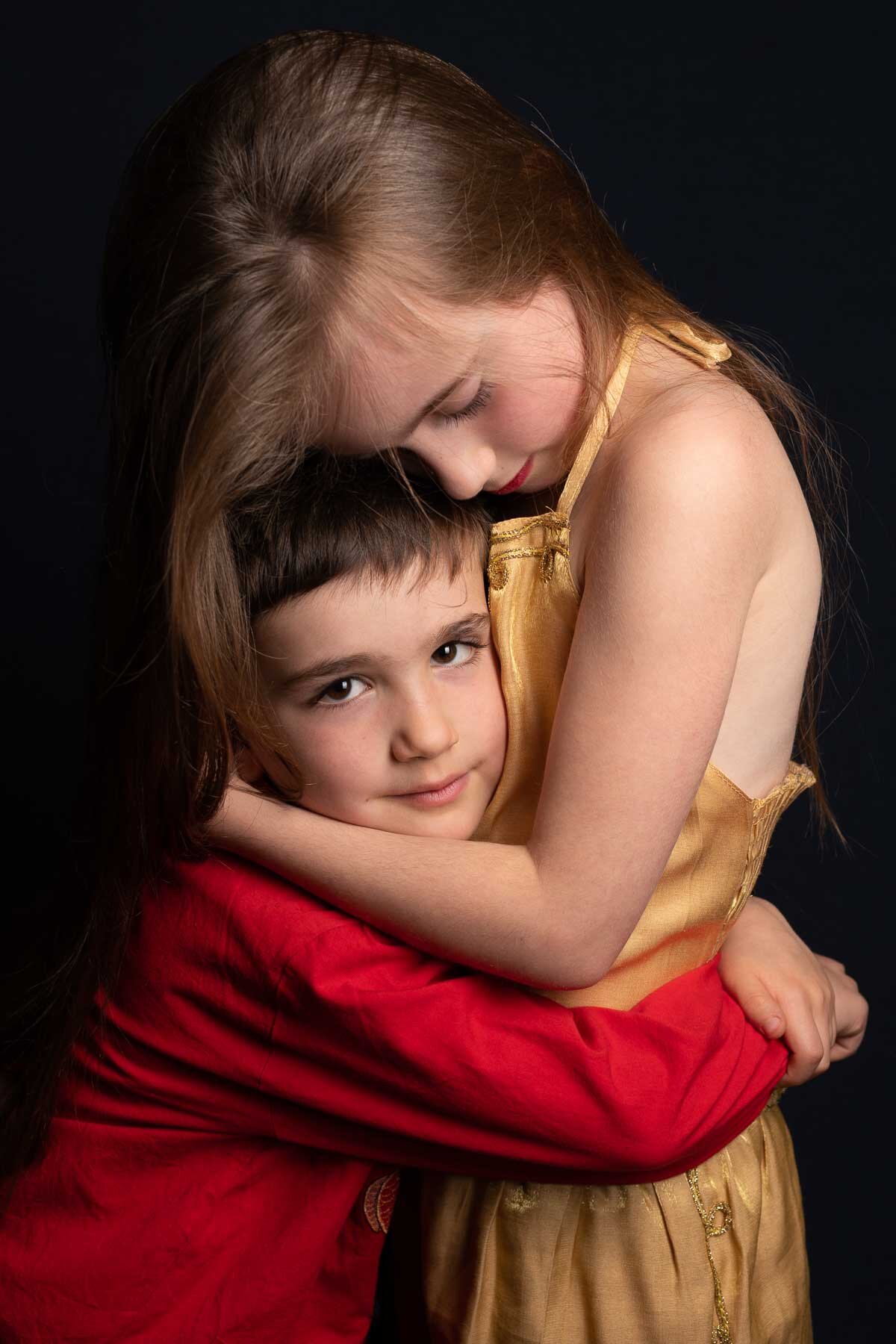  This brother and sister came to the studio with their mother. We made a series of individual portraits of each of them, and at the end they spontaneously hugged. Luckily, I was quick enough to capture the moment. 