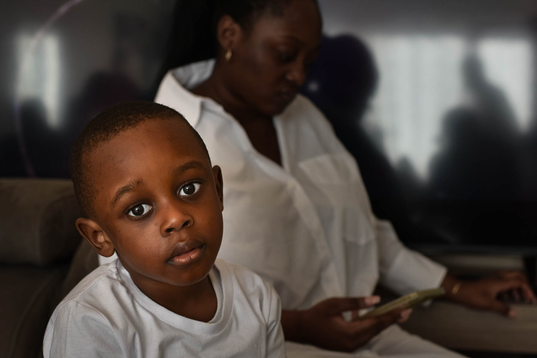  I was photographing a family party. I think this young boy was bored by the adult conversation. I love the openness of his gaze. 