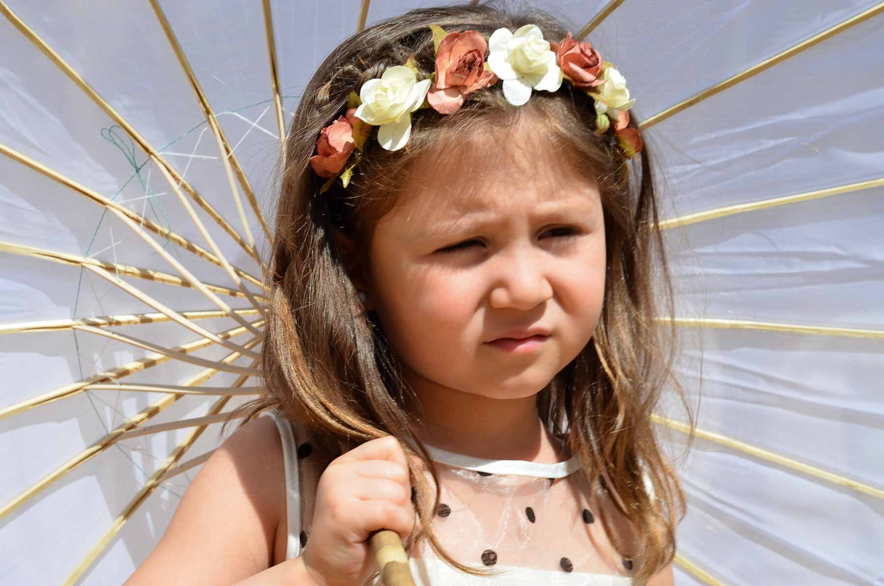  A young girl at a summer wedding. 