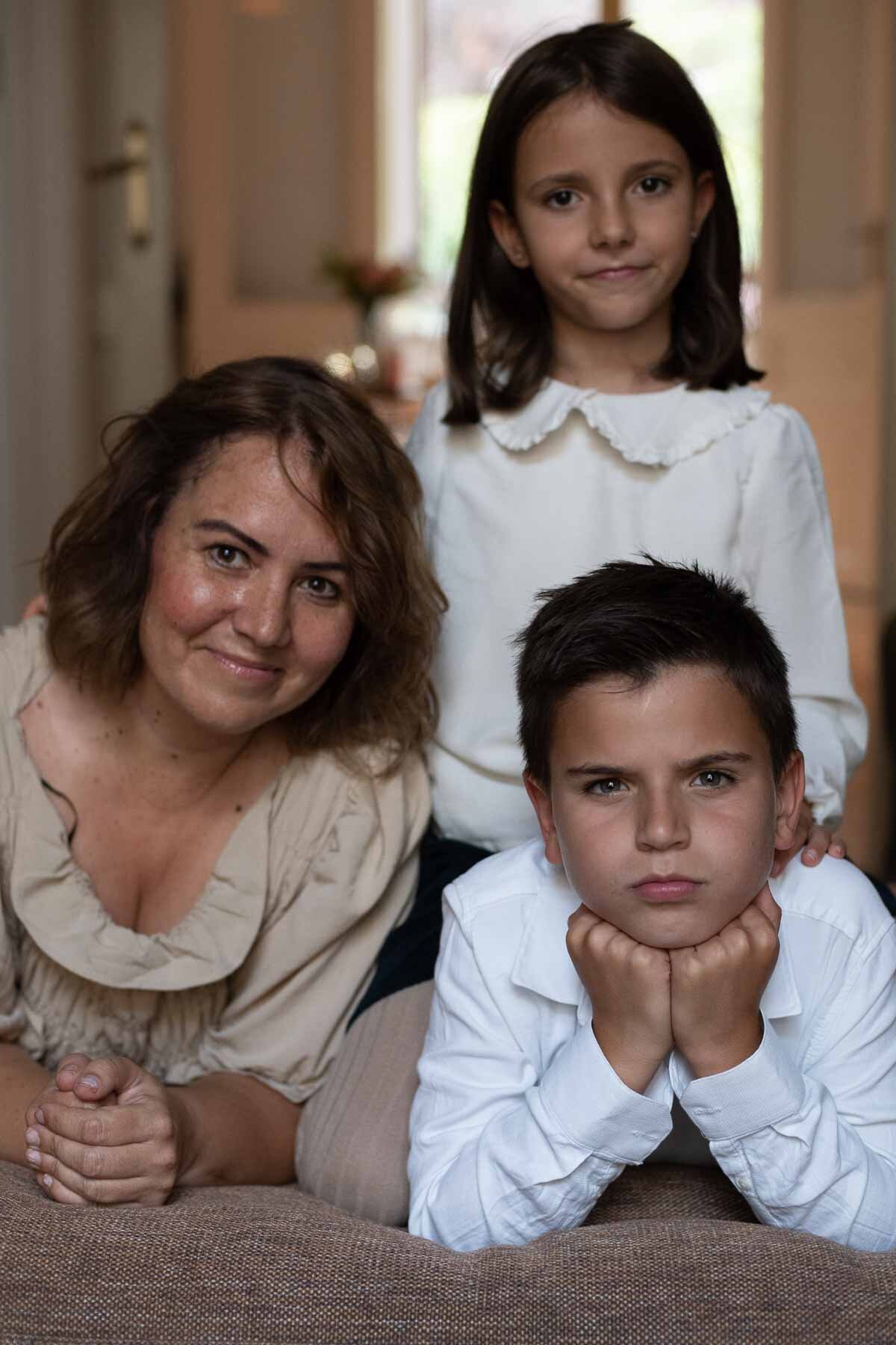  Two children with their mother, home portrait 