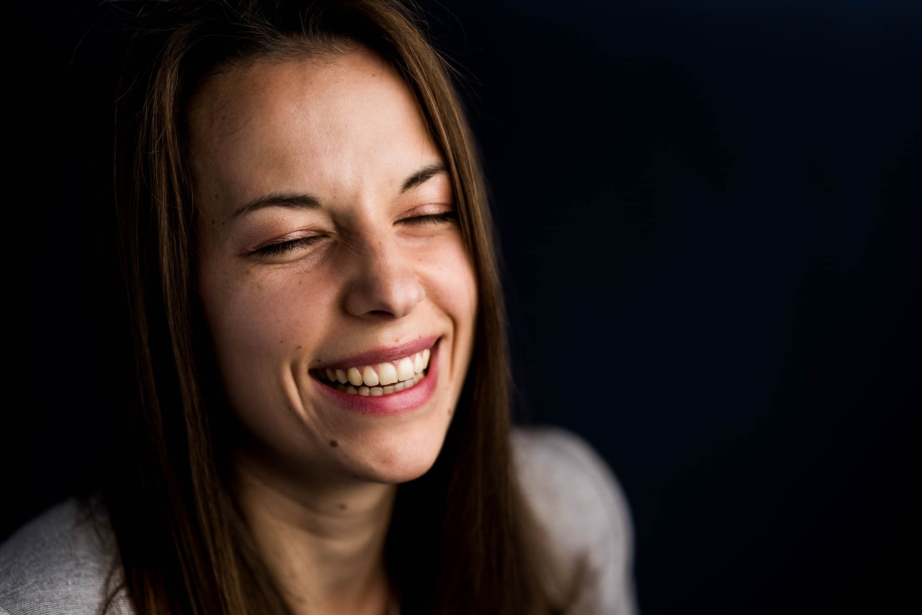  Studio portrait of a young woman laughing 