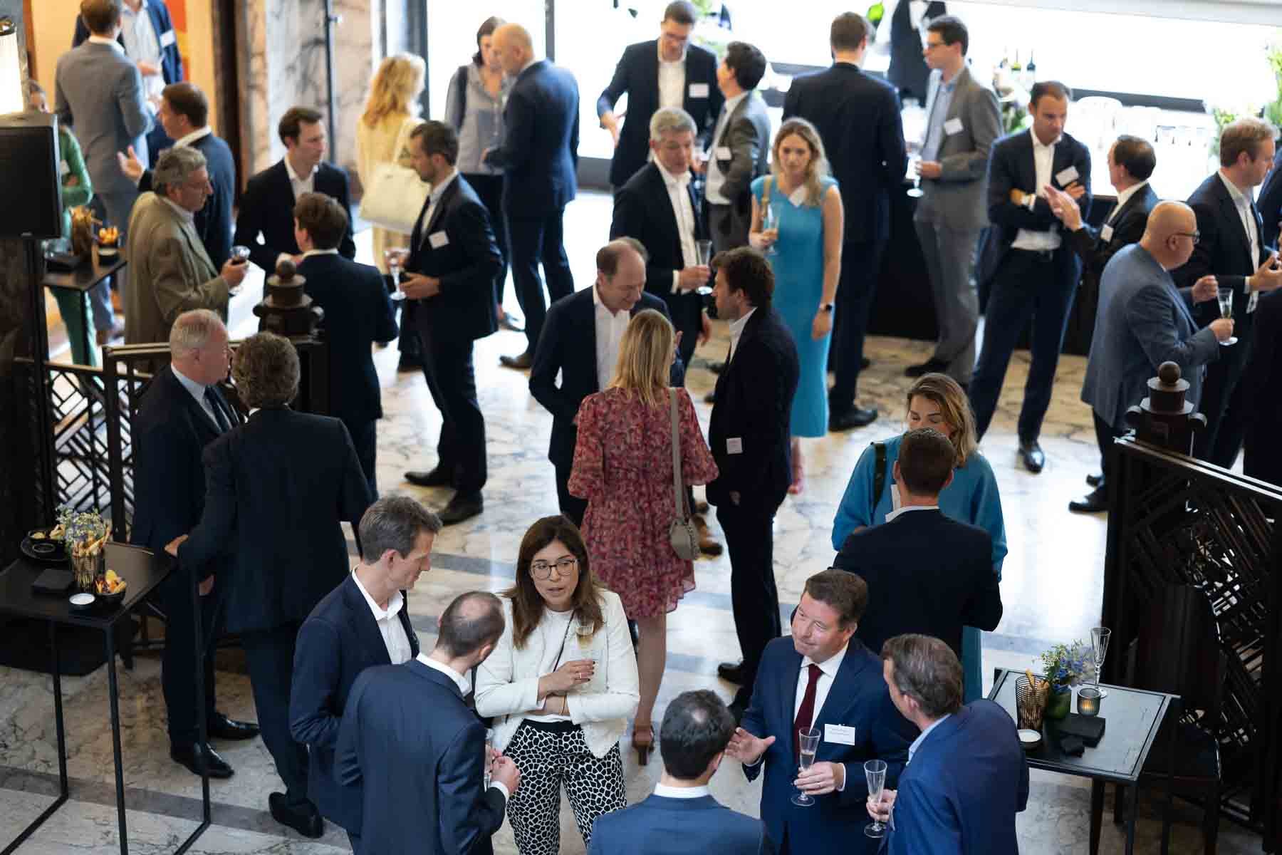  Guests mingle at a corporate reception 
