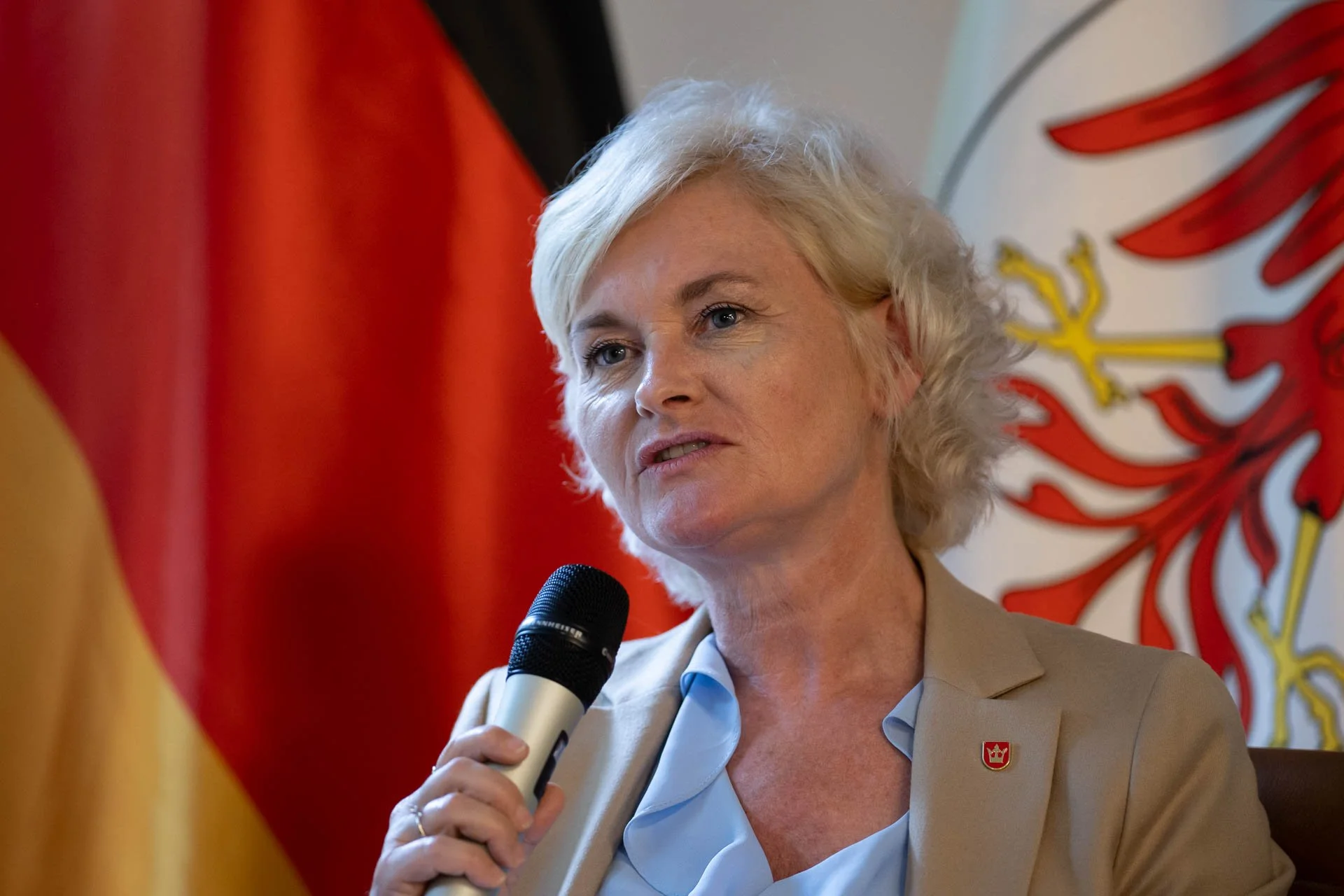  Conference speaker with flags in the background 