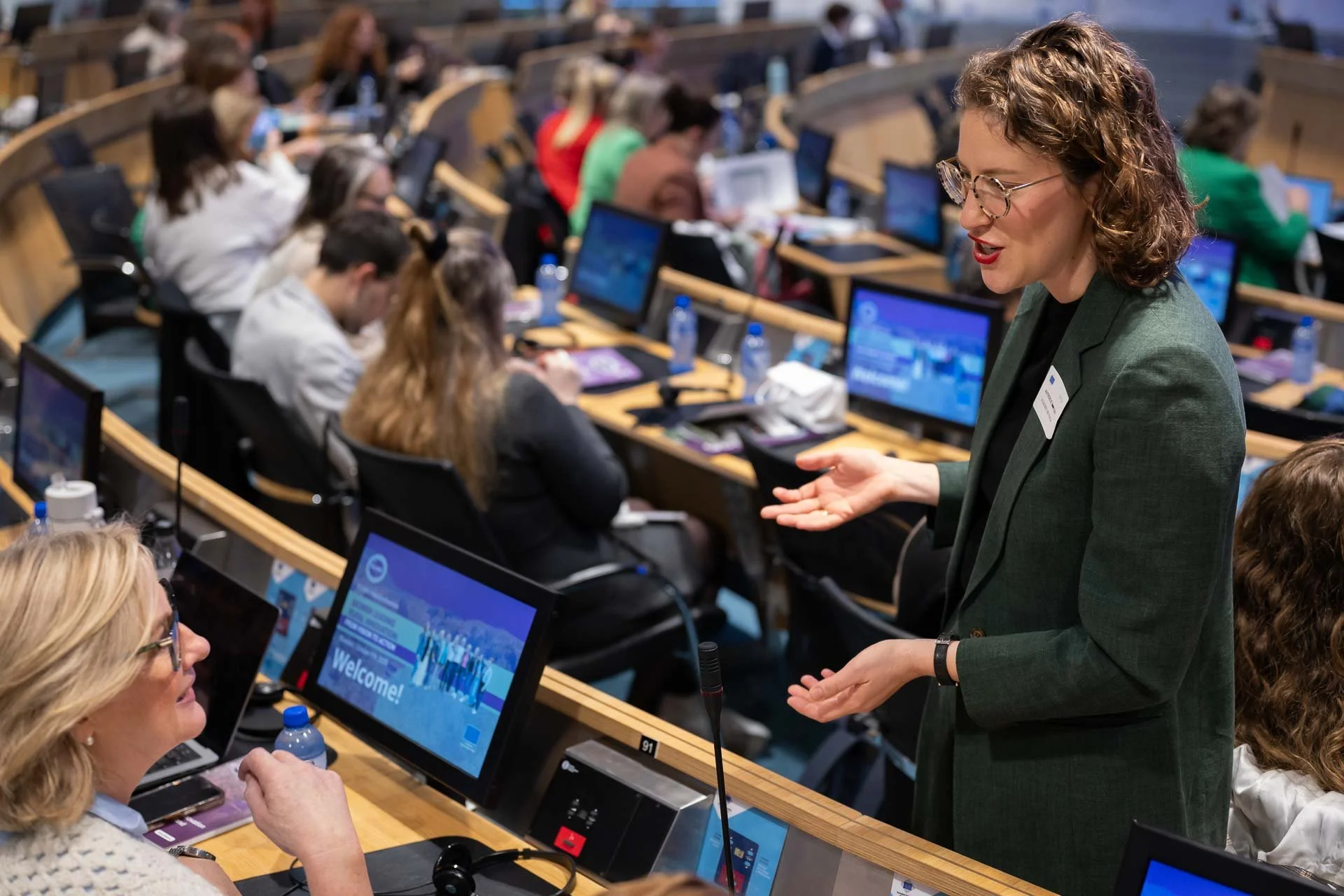  Partners in discussion before an end-of-project conference at the European Committee of the Regions. 