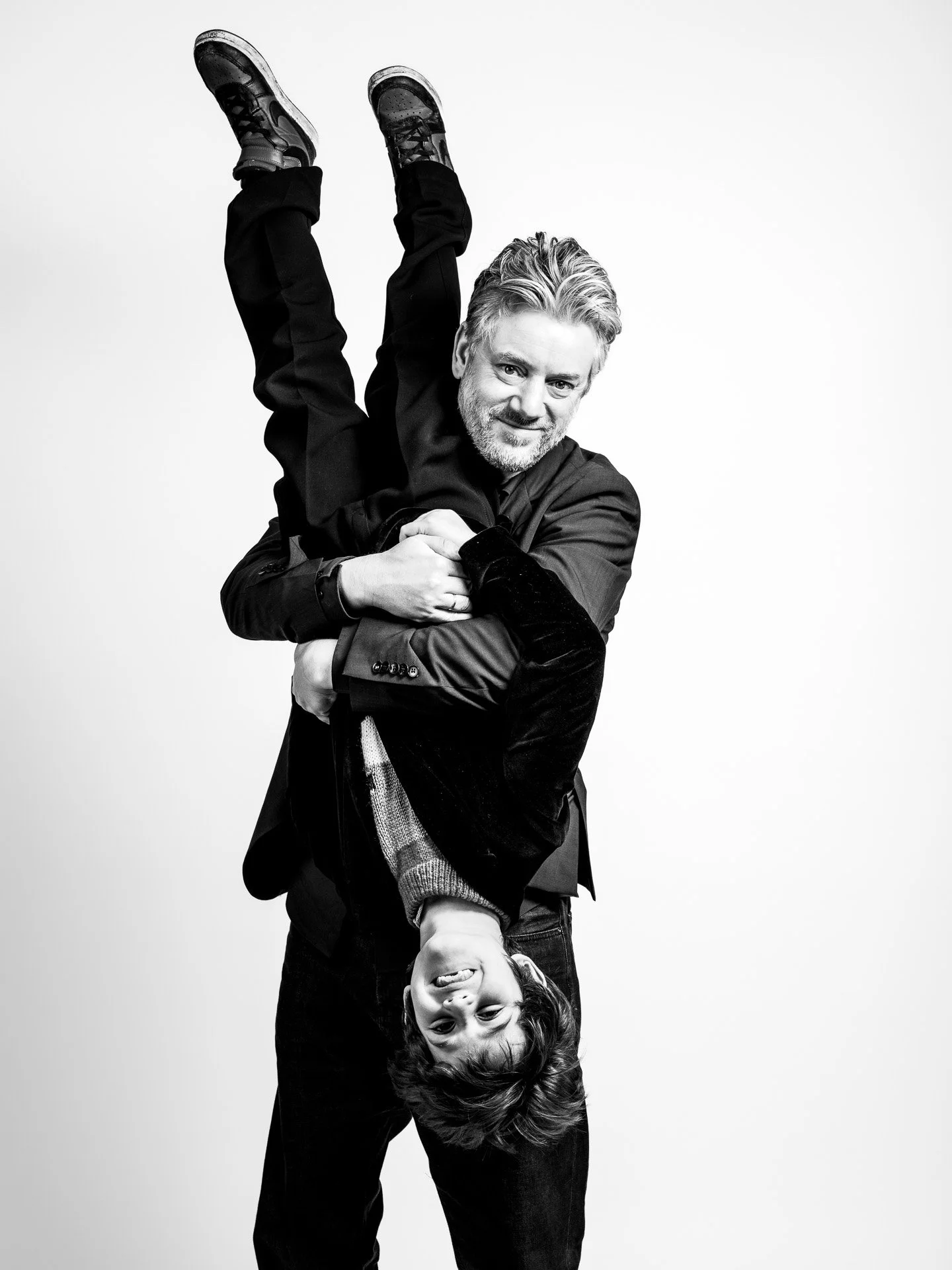  Studio shot of a father and son horsing around 